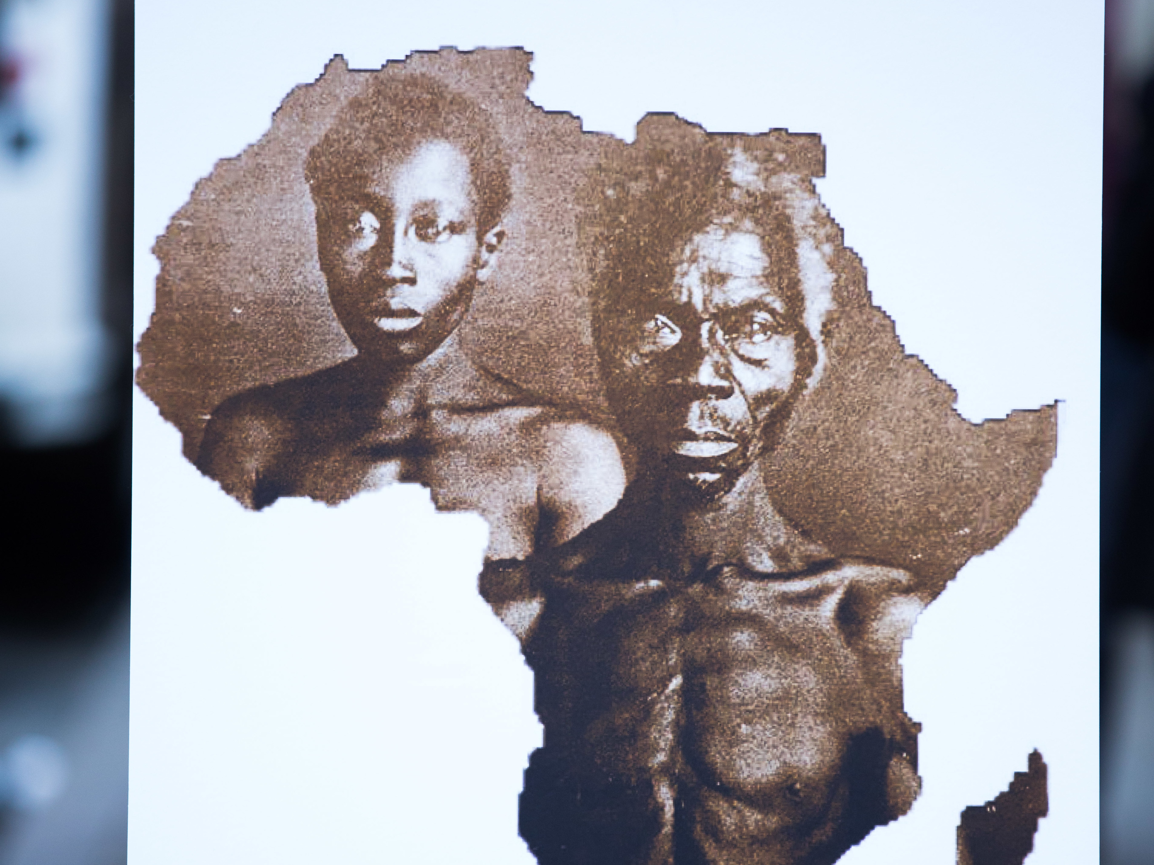 A sample image of &quot;Papa&quot; Renty and his daughter Delia, taken in 1850, are displayed during a press conference announcing a lawsuit against Harvard University on Wednesday in New York City. (Getty Images)
