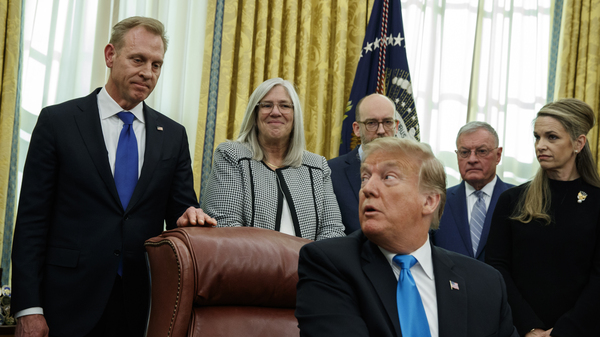 Acting Secretary of Defense Patrick Shanahan listens as President Trump speaks during a signing event for Space Policy Directive 4 in the Oval Office last month.