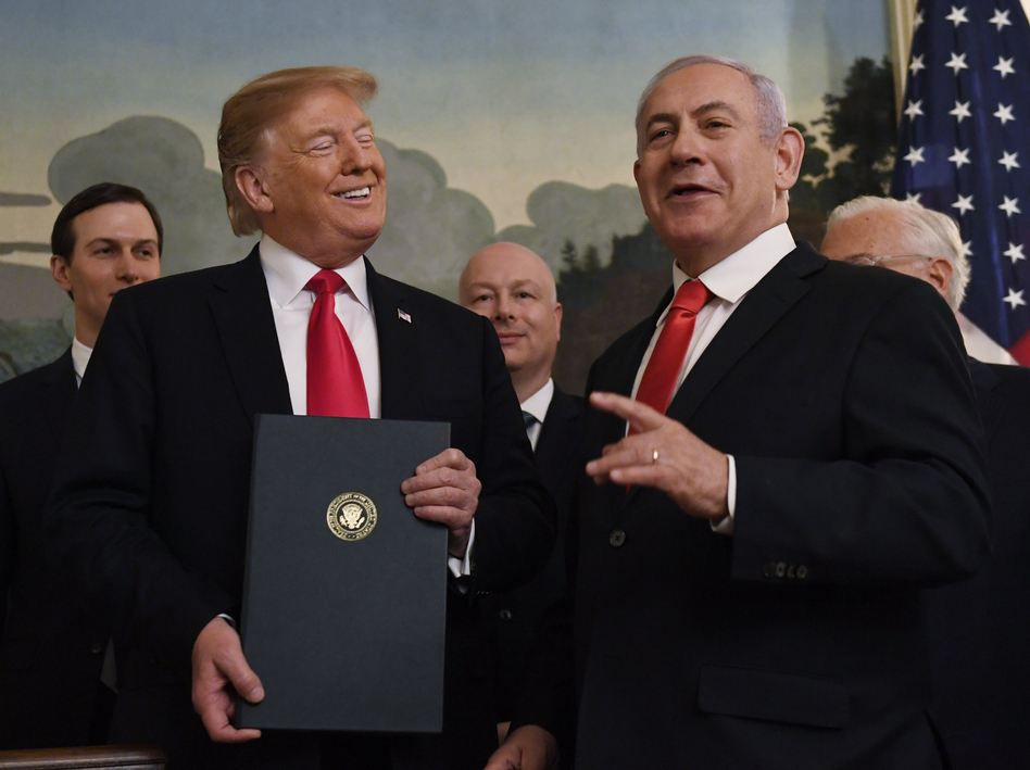 President Trump stands with Israeli Prime Minister Benjamin Netanyahu during a ceremony to sign a proclamation recognizing Israel's sovereignty over the Golan Heights, on Monday. (Susan Walsh/AP)