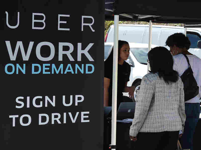 People sign up to become Uber drivers at the first Uber Work On Demand recruitment event.