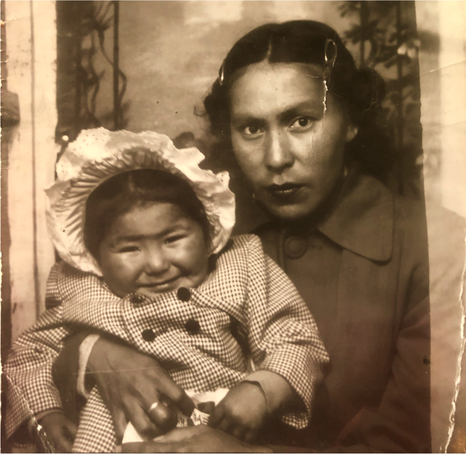 A photo taken in 1953 shows Corey Gray's mother, Sharon Yellowfly, held by her mother, Cecile Yellowfly.