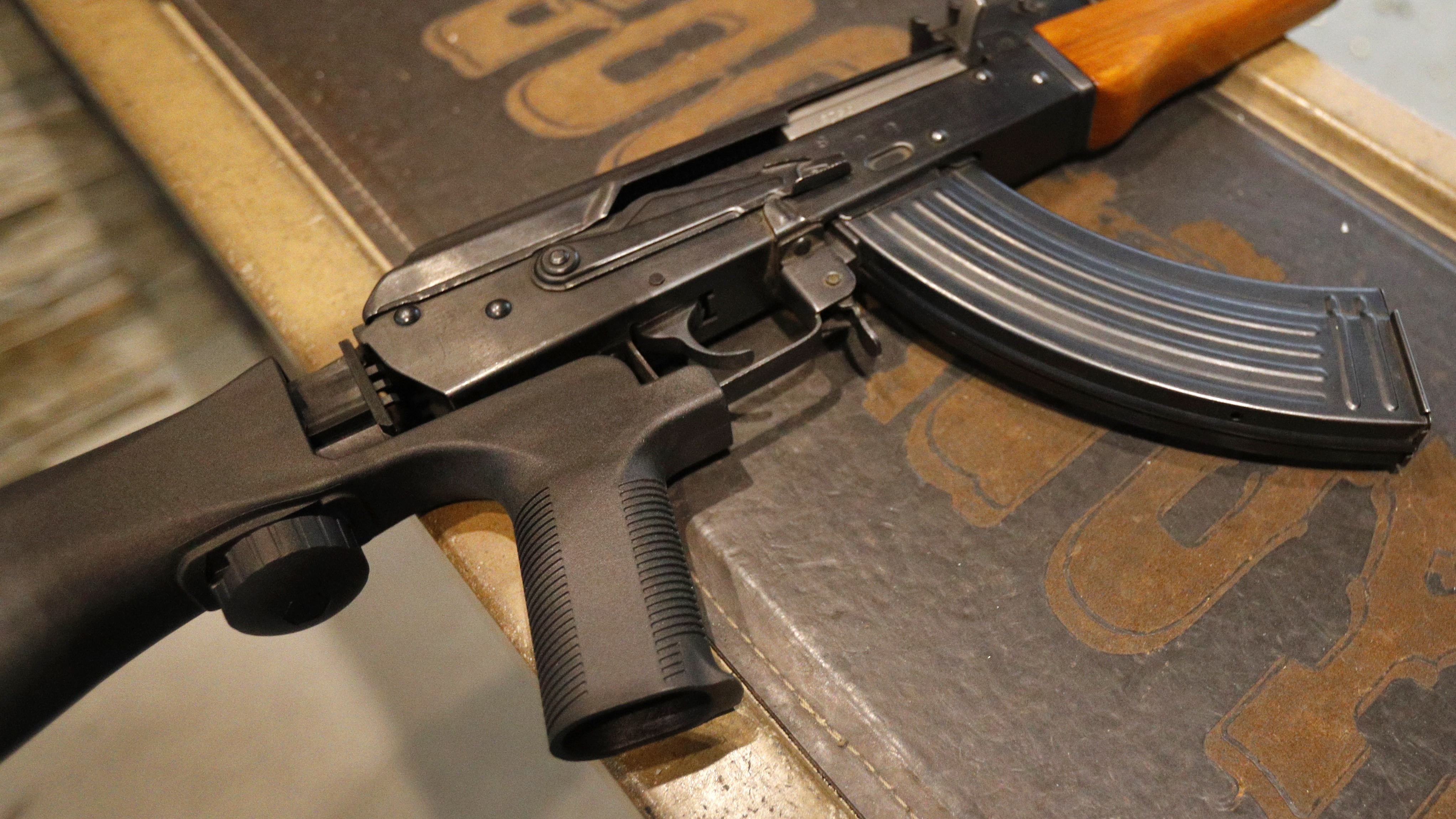 Bump stocks like this one installed on an AK-47 are now illegal in the U.S., after the Trump administration changed how they are legally defined.  The devices can allow a semi-automatic rifle to fire nearly as fast as a machine gun. (Getty Images)