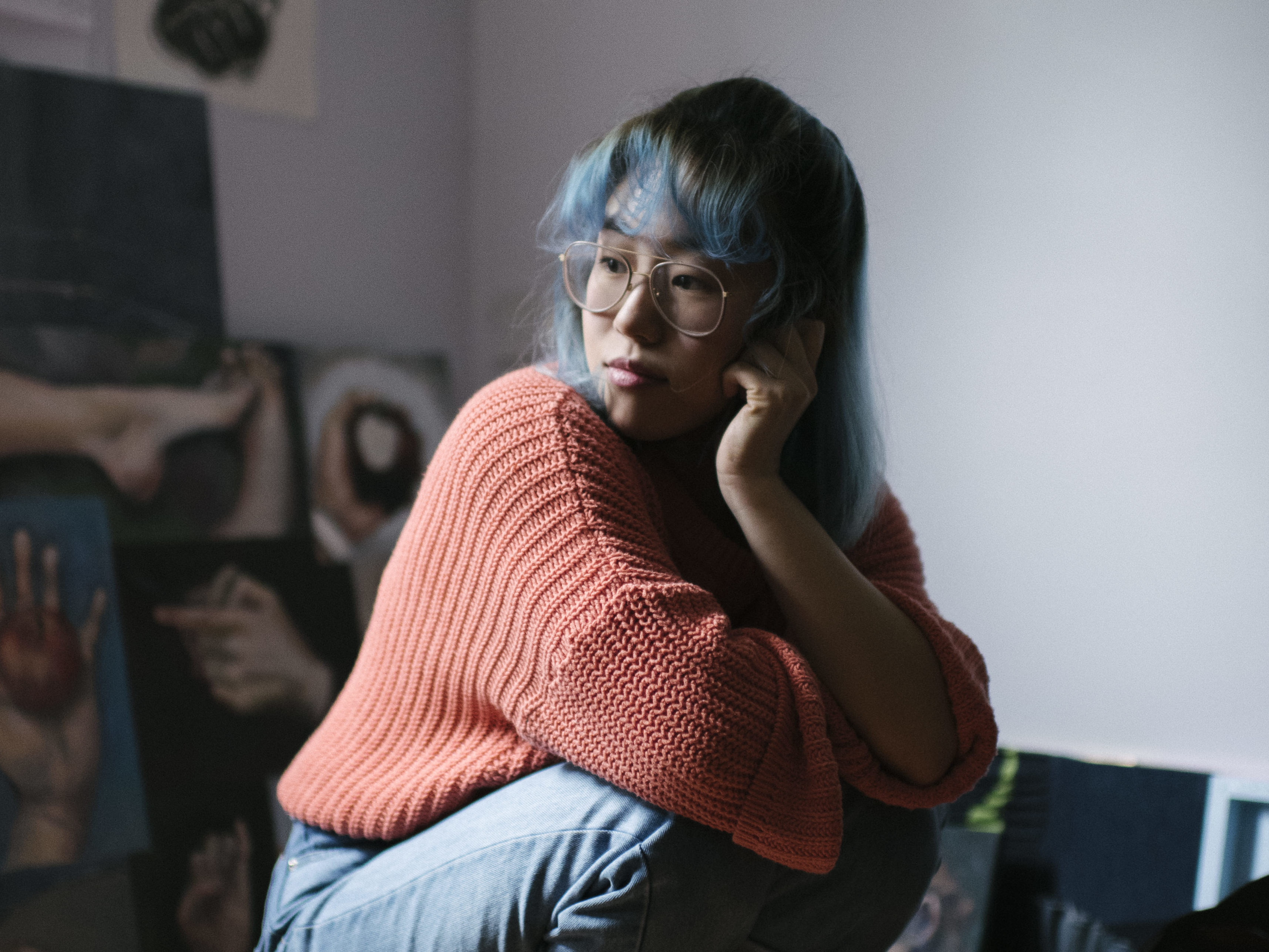 Kim hangs out in her art studio and room in Toronto. Kim uses the language of fashion, art, and literature to challenge the abuse of religion and/or culture in the Korean Christian community. Kim was born in 1995 in Vancouver, Canada. She has lived in South Korea and Canada. (Hannah Yoon)