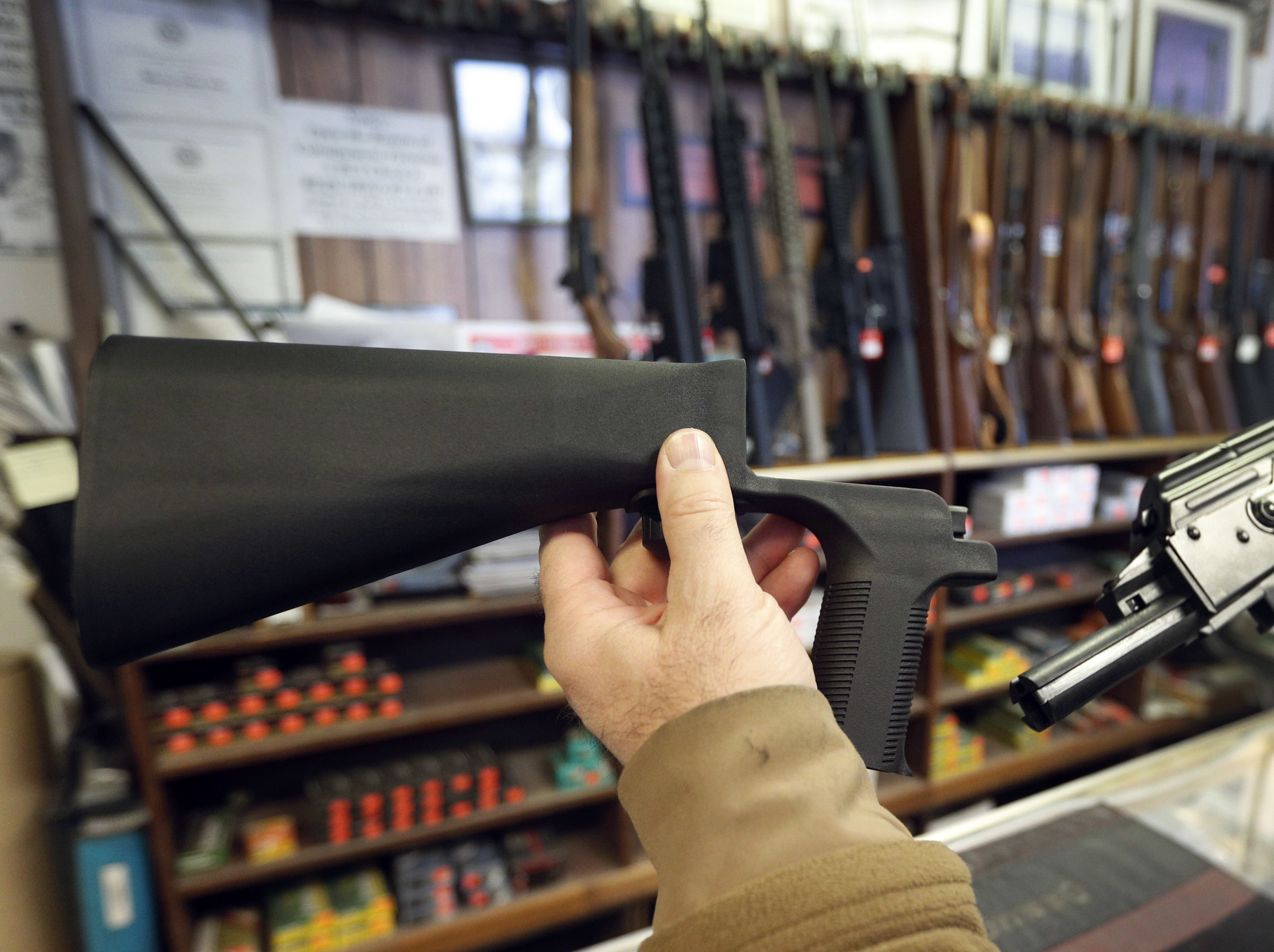 A bump stock, left, is a device that can be added to a gun to increase its firing speed. The devices were banned by the federal government his week. (Getty Images)