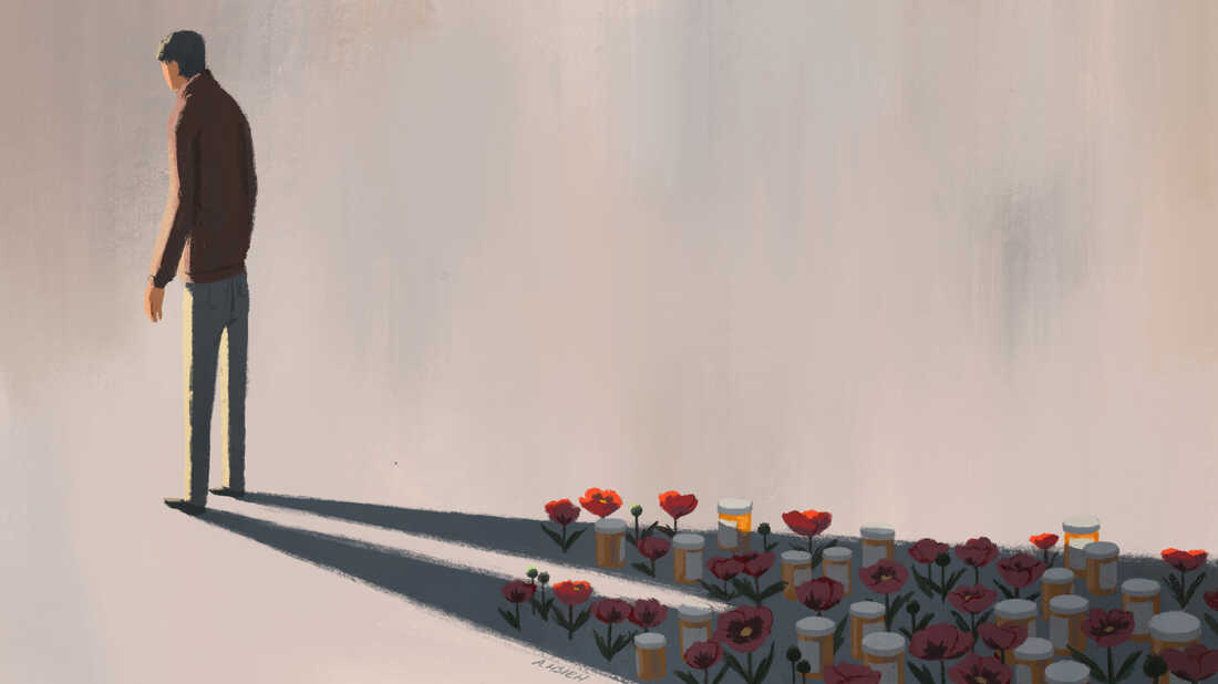 Man standing, opioids in shadow.