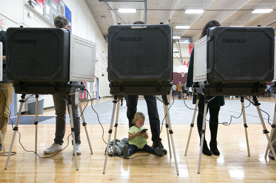 Voters at an Atlanta high school on Election Day 2018. Georgia Gov. Brian Kemp has signed a new law addressing some of the complaints about how that election was run. (Jessica McGowan/Getty Images)
