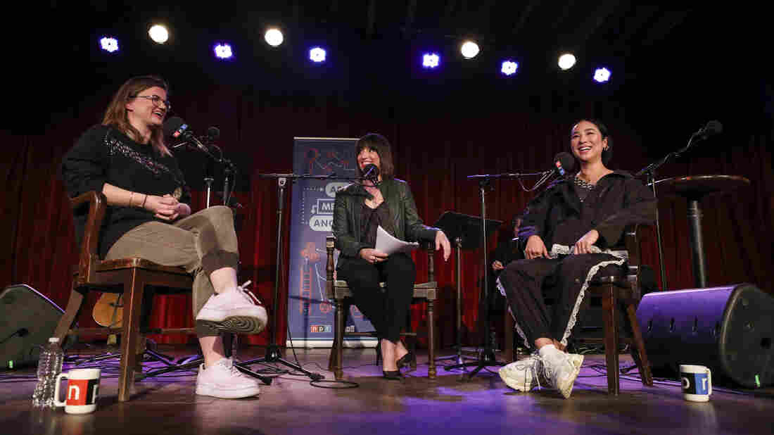 Host Ophira Eisenberg chats with Lesyle Headland and Greta Lee on Ask Me Another at the Bell House in Brooklyn, New York.
