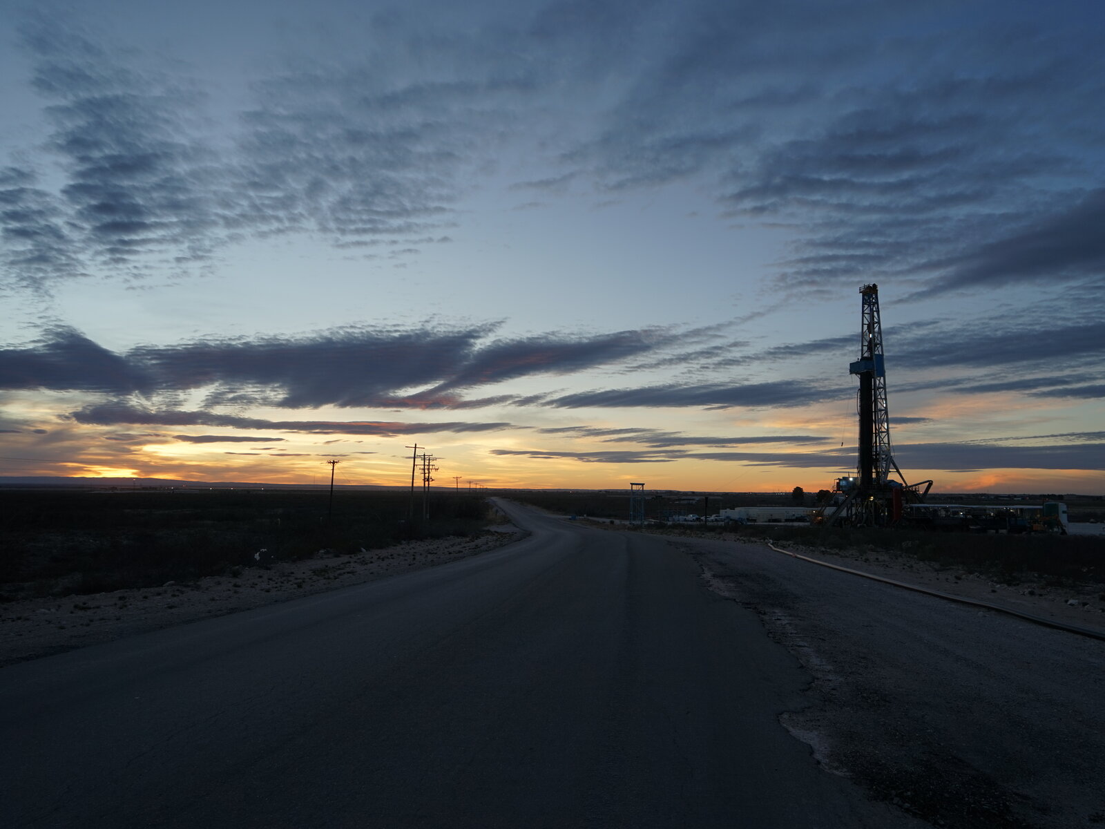 Drilling rigs and pump-jacks dot the desert of the Permian Basin, where Holtec is proposing to build the interim nuclear storage facility. Nathan Rott/NPR