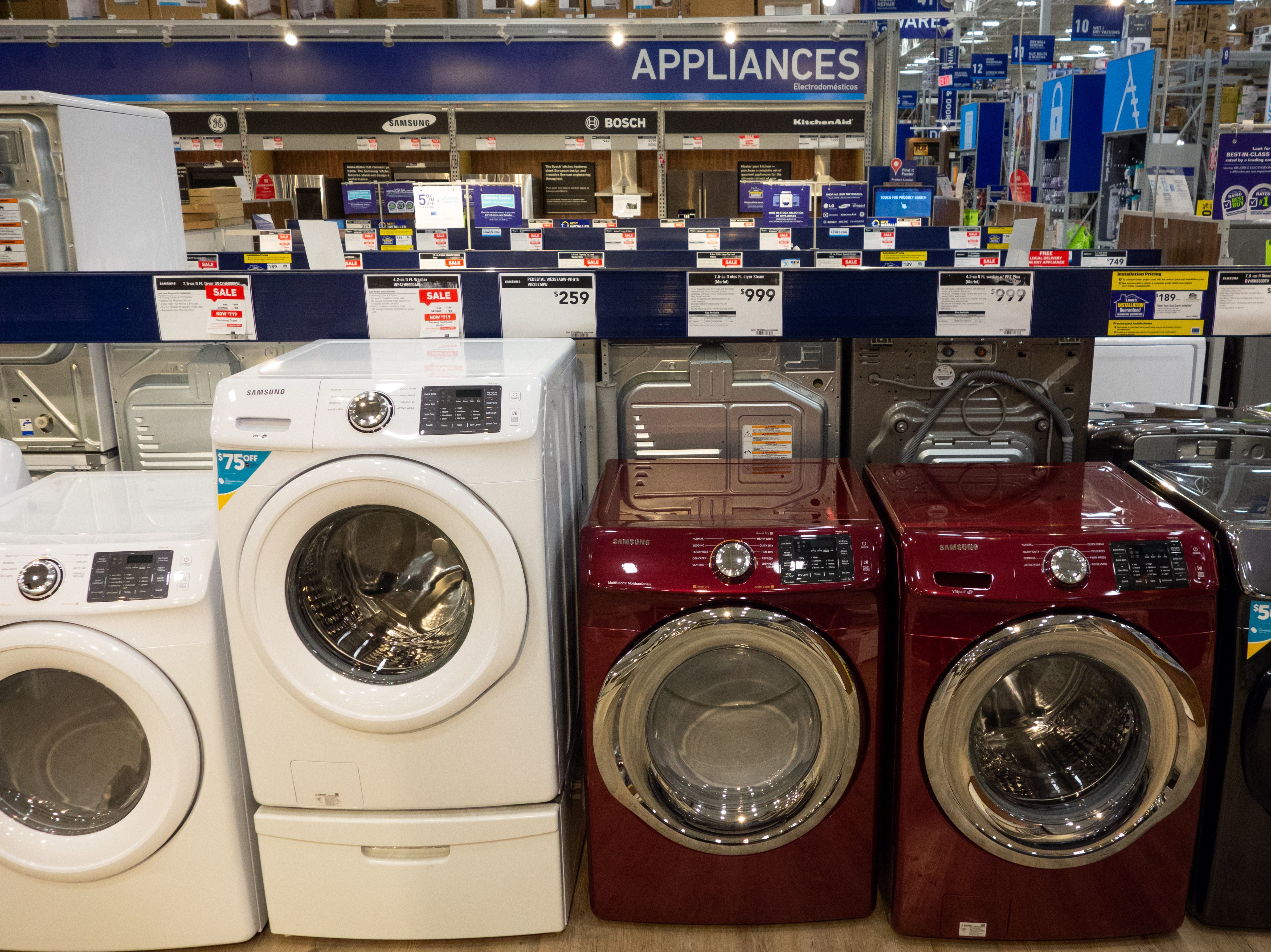 Overall, prices of major appliances tracked by the consumer price index are starting to tick down month-to-month. But they are still higher than they were last year. Washing machines, dryers and other appliances are seen for sale at a Lowe's home improvement store in Washington, D.C., in 2018.