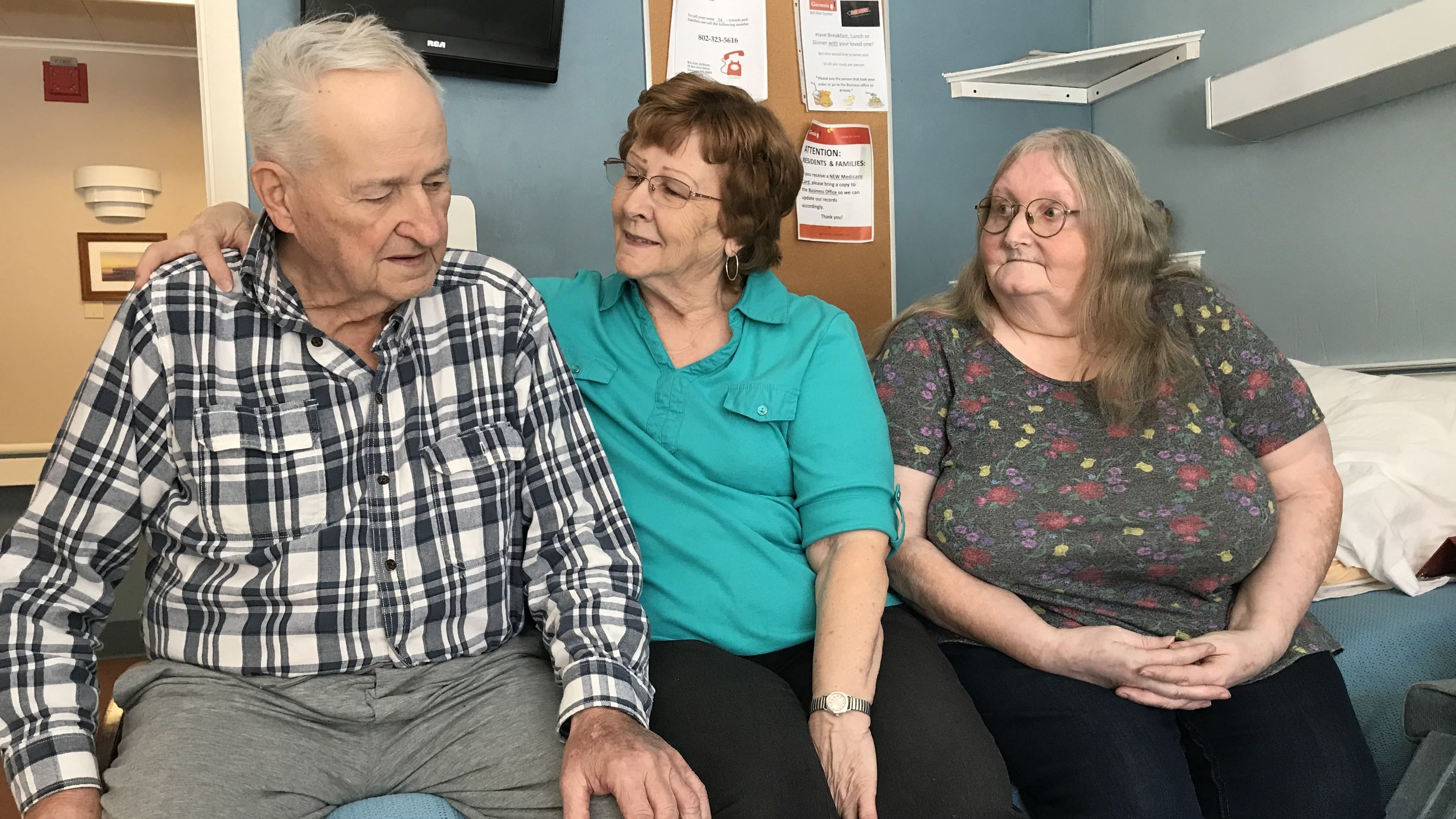 Joan Bousquet of Irasburg (center) has visited her husband Robert Bousquet at the Bel-Aire Center, a nursing home in Newport, Vt., every day since his long-delayed arrival. Diane Bapp of Barton, a family friend, often joins them.
