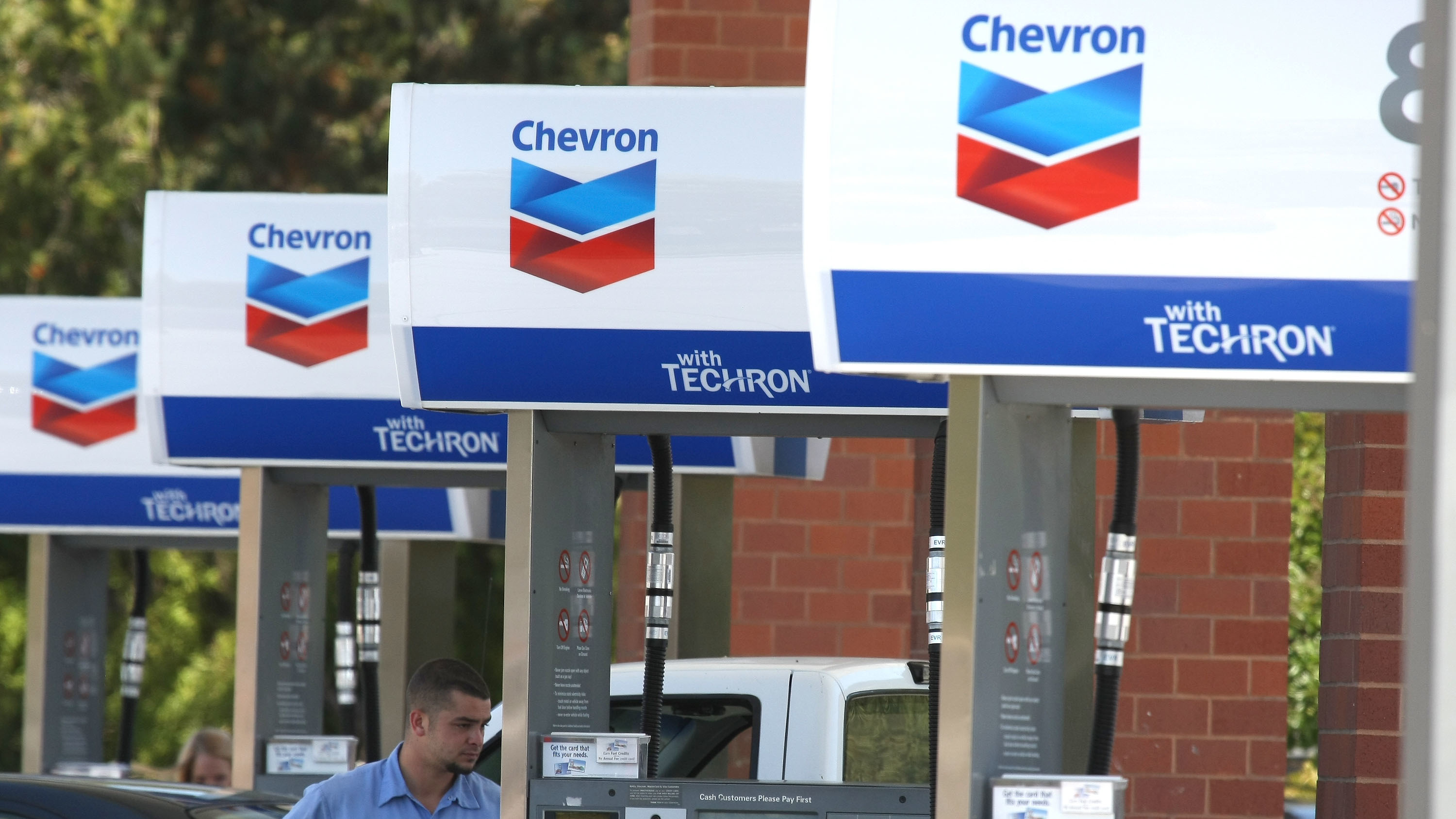 A Chevron customer pumps gas into his car in 2009 in Greenbrae, Calif. Chevron is acquiring Anadarko Petroleum for $33 billion in cash and stock. (Getty Images)