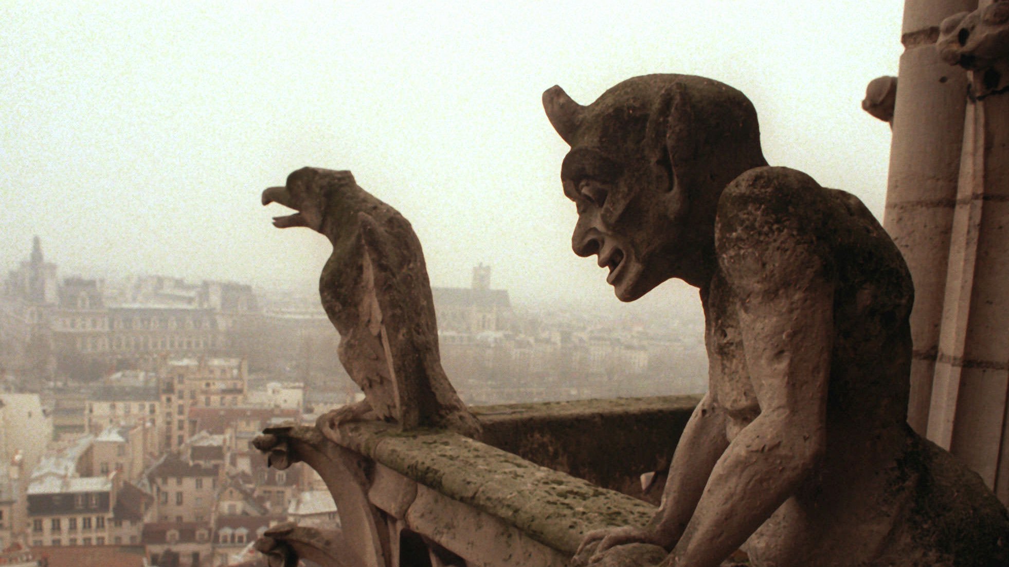 Gargoyles watch over the streets of Paris from the top of the Notre Dame Cathedral in 1996.