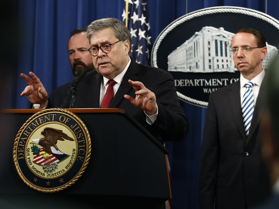 Attorney General William Barr, center, holds a press conference Thursday before the redacted Mueller report's release.