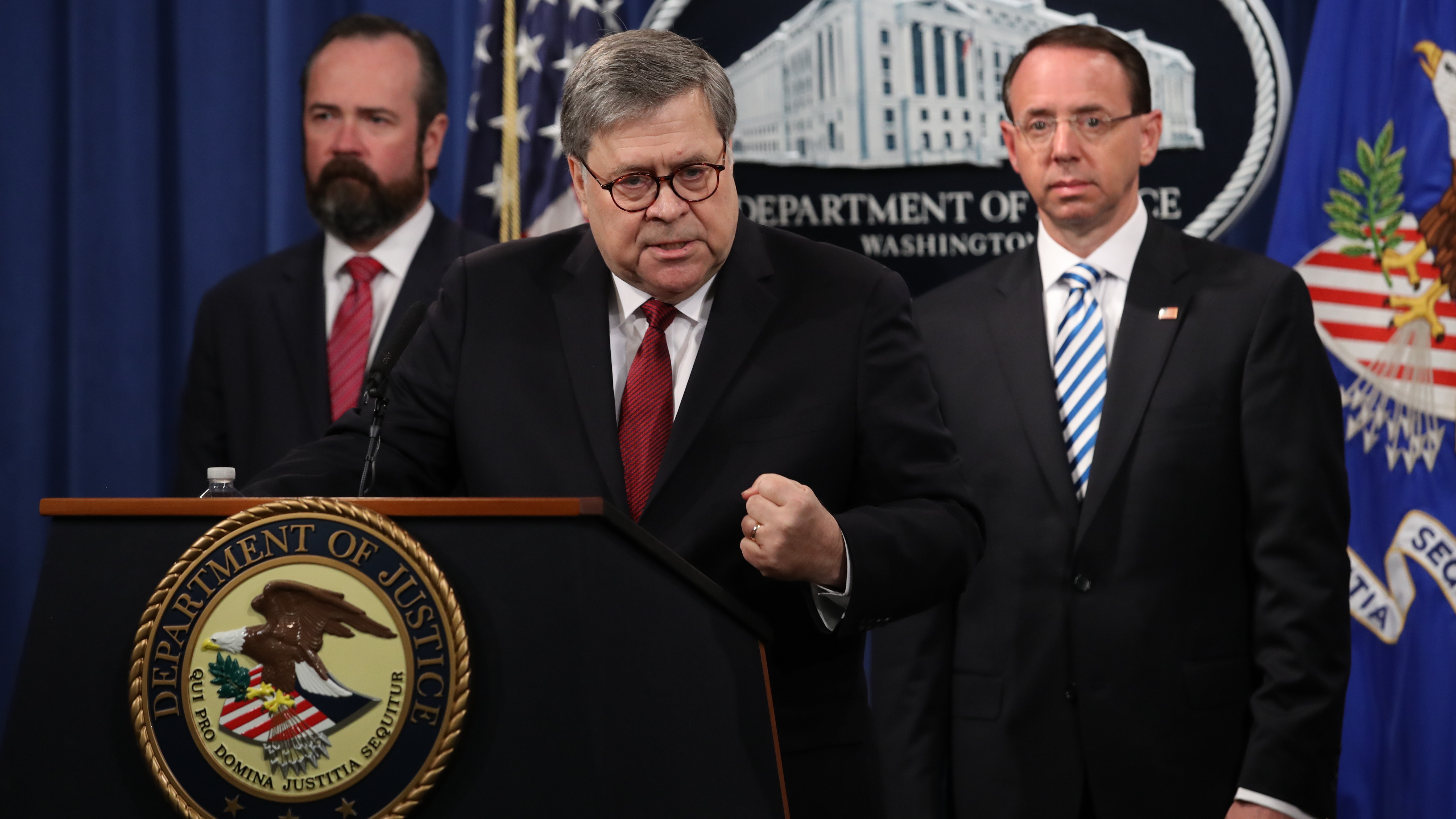 Attorney General William Barr speaks about the redacted version of the Mueller report as U.S. Deputy Attorney General Rod Rosenstein (right) and U.S. Acting Principal Associate Deputy Attorney General Ed O'Callaghan listen at the Department of Justice Thursday before the document's release. (Getty Images)