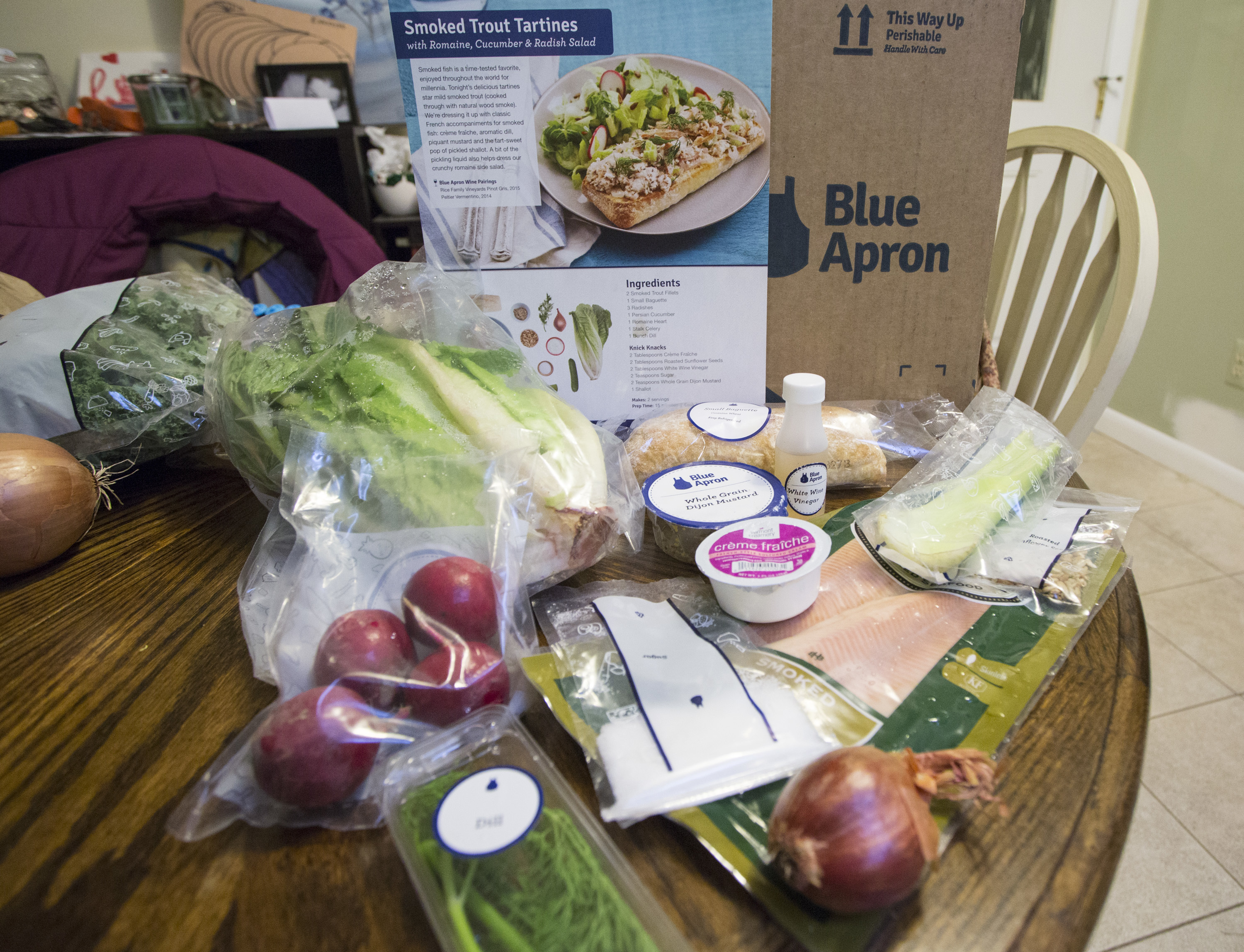 While it may seem that heaps of plastic from meal kit delivery services like Blue Apron make them less environmentally friendly than traditional grocery shopping, a new study says the kits actually produce less food waste. (Portland Press Herald via Getty Images)