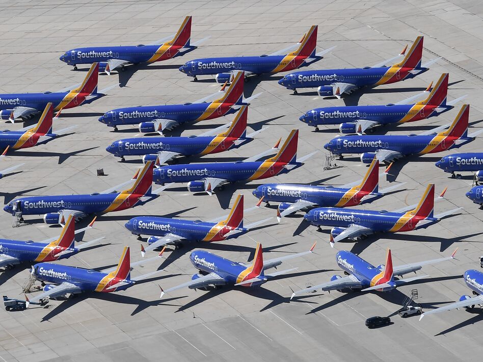 Southwest Airlines Boeing 737 Max aircraft are parked on the tarmac after being grounded, at the Southern California Logistics Airport in Victorville, Calif., on March 28. Boeing said its financial outlook is uncertain as it deals with the 737 Max grounding. (Mark Ralston/AFP/Getty Images)