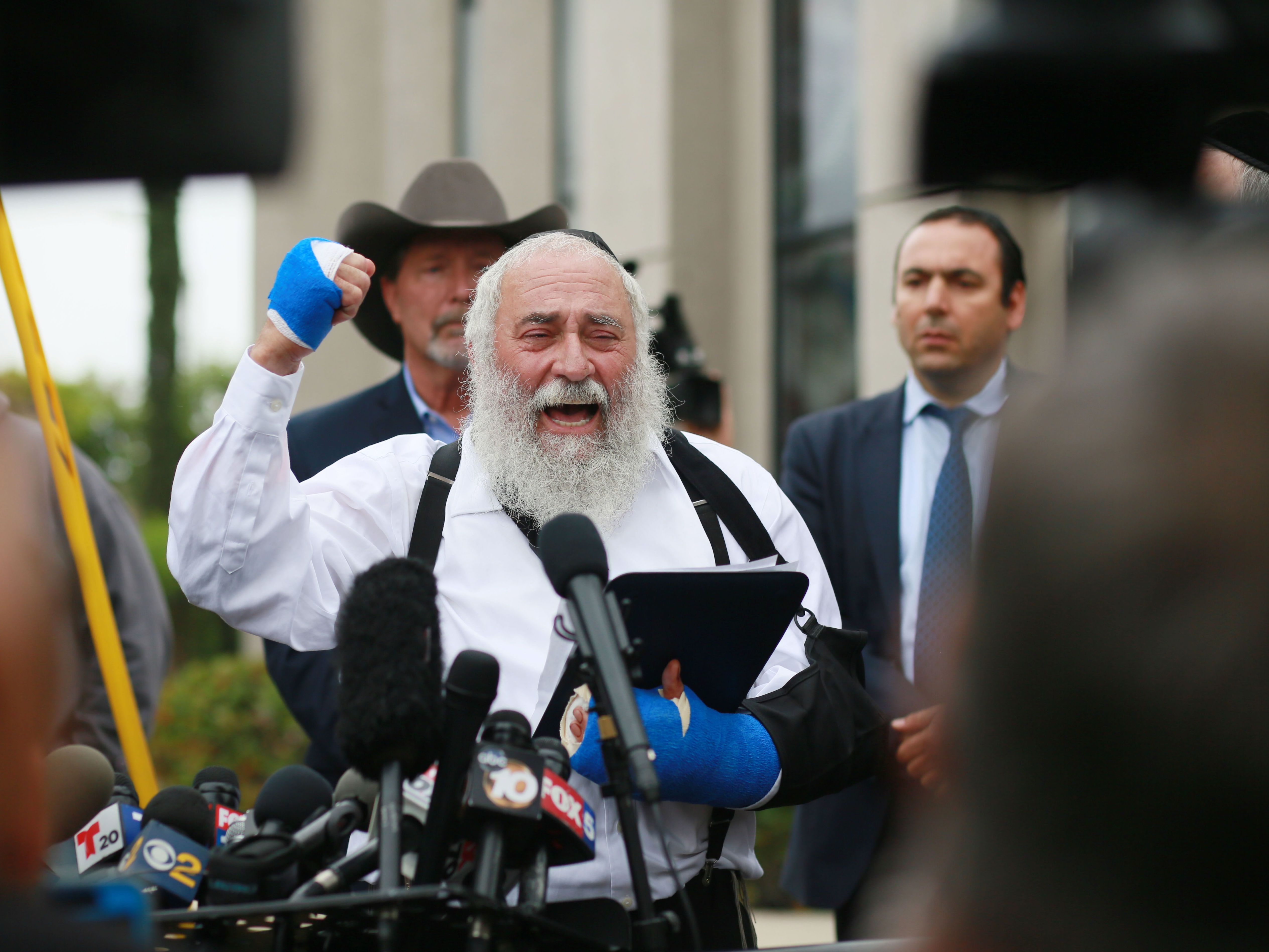 A day after his synagogue was attacked, Rabbi Yisroel Goldstein held a press conference outside the Chabad of Poway Synagogue to recount what happened during the deadly attack. (AFP/Getty Images)