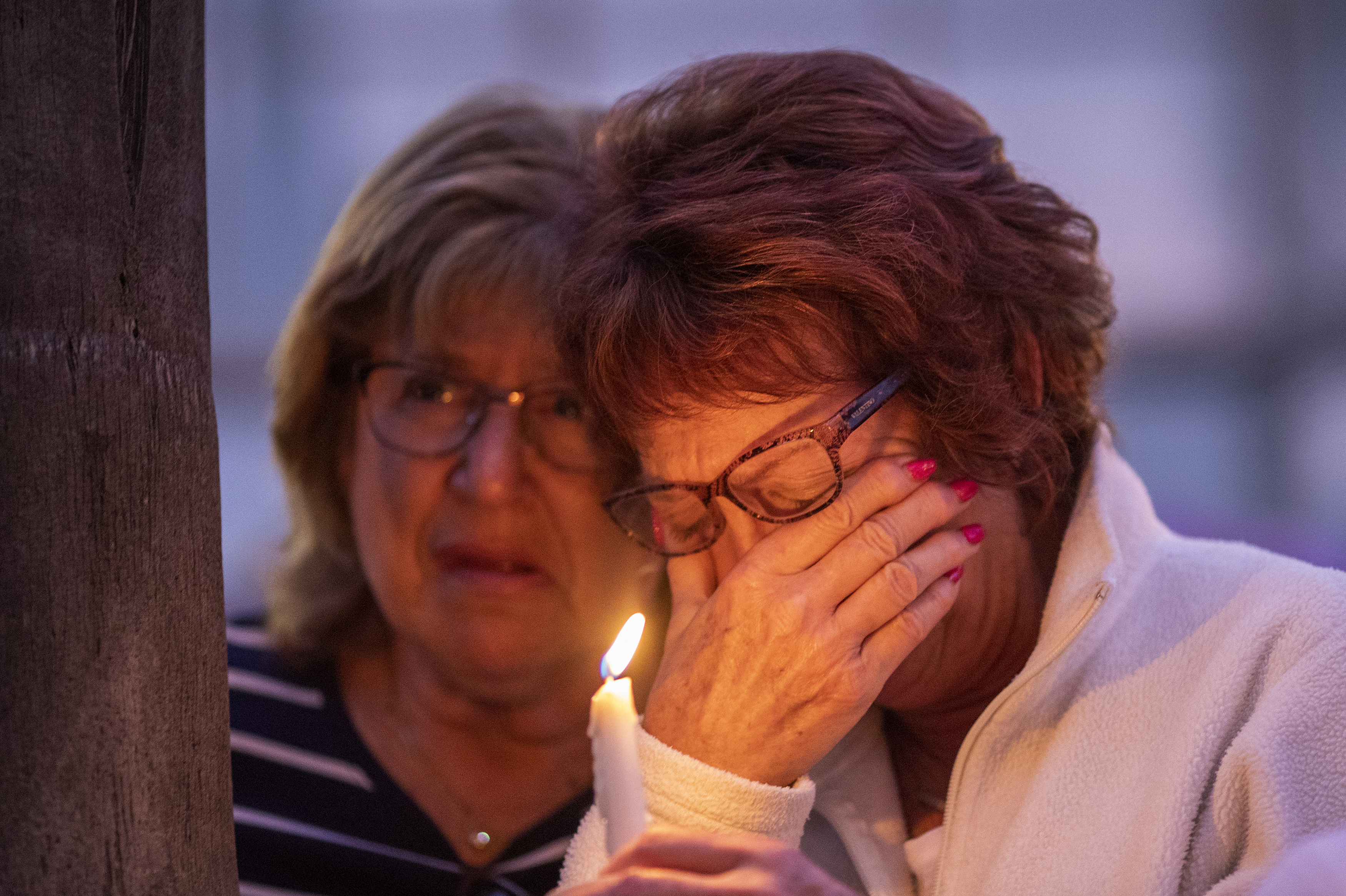 People at Rancho Bernardo Community Presbyterian Church in San Diego attend a prayer and candlelight vigil for victims of the synagogue shooting in Poway, Calif., on Saturday. (Getty Images)