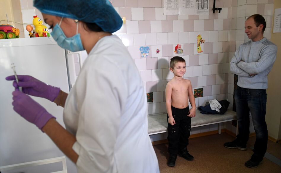 A nurse prepares a syringe for a measles vaccination at a pediatric clinic in Kiev, Ukraine. The country had 72,408 measles cases in the year from March 2018 to February 2019 — the highest number for any country during that period. (Sergei Supinsky/AFP/Getty Images)