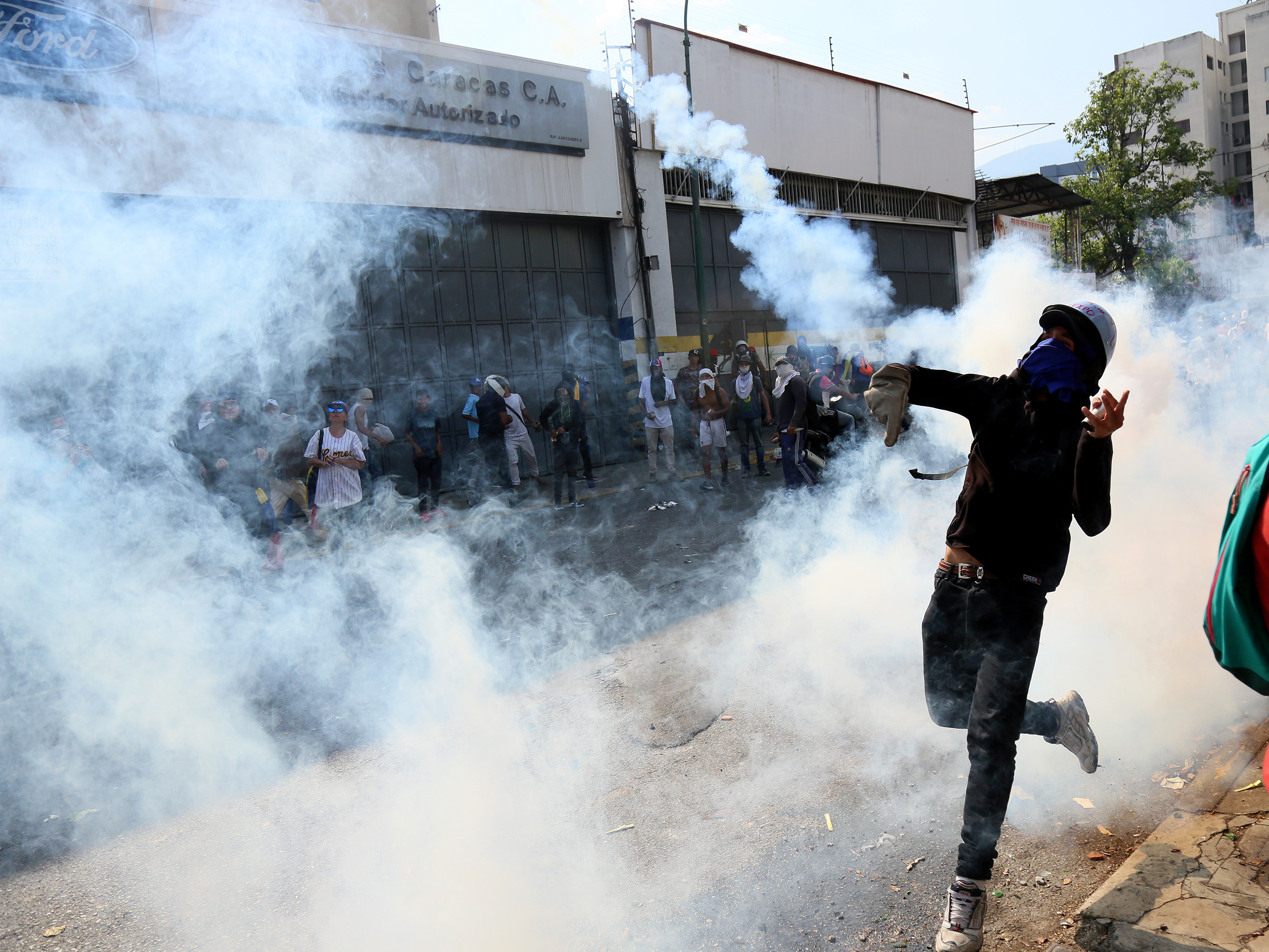 Government military police officers confront pro-Guaidó demonstrators at Altamira Square on Tuesday in Caracas, Venezuela. (Getty Images)