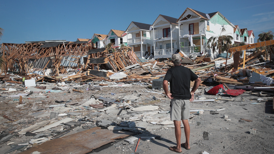 A resident of Mexico Beach, Fla., looks over damage caused to the Florida Panhandle by Hurricane Michael in October 2018. (Scott Olson/Getty Images)