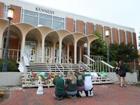 Students and faculty honor the victims of a shooting at the University of North Carolina Charlotte.