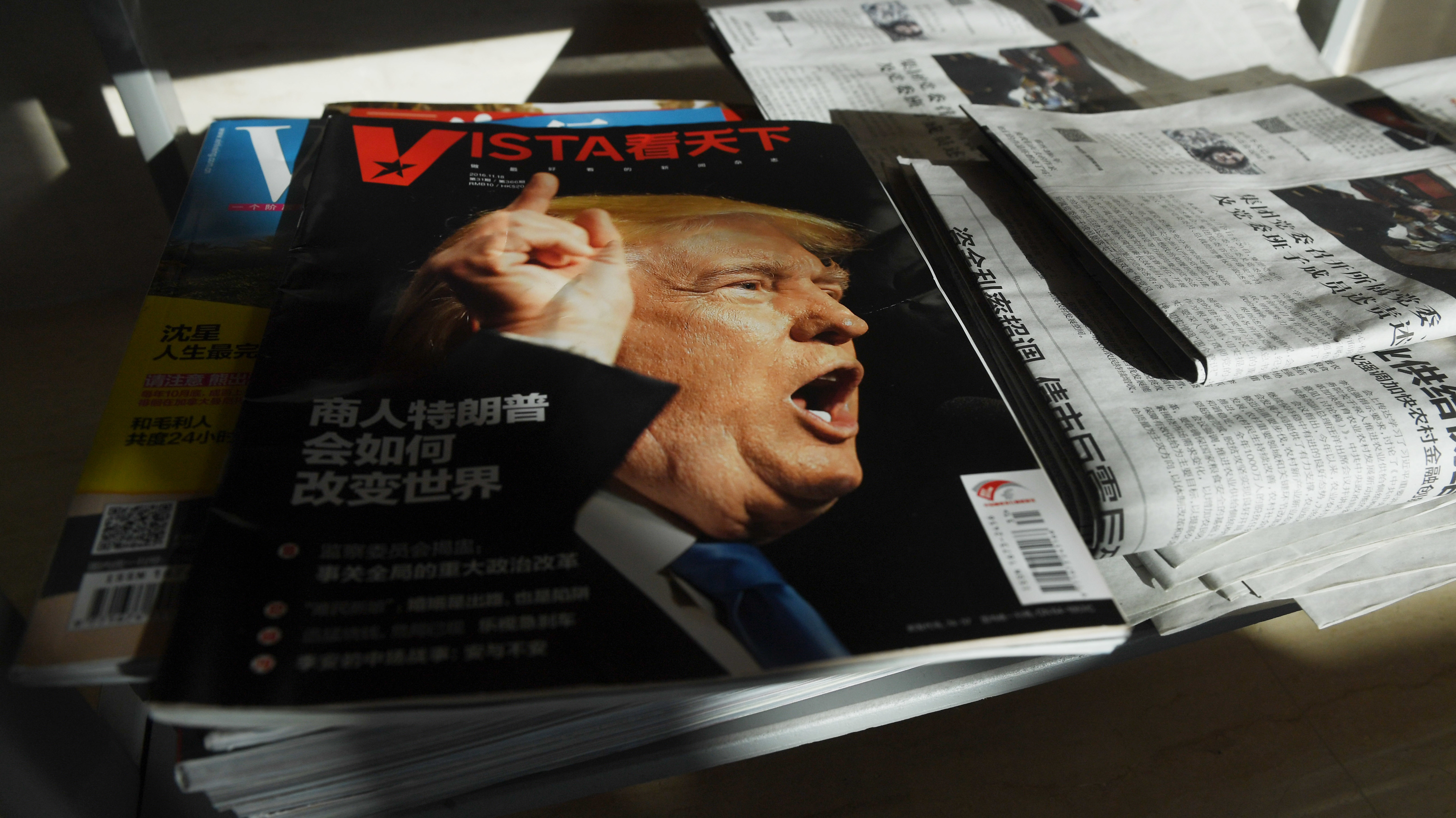 A magazine's cover line in Beijing asks, &quot;How will Trump the businessman change the world?&quot; on Dec. 28, 2016, days after then President-elect Donald Trump tapped outspoken China critic Peter Navarro for a top trade position. (AFP/Getty Images)
