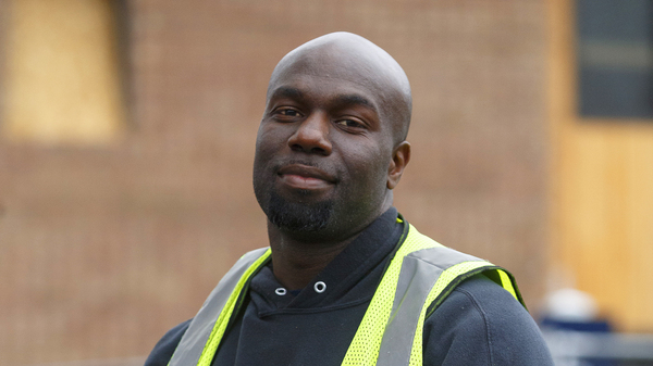 Ichard Oden works at an apartment complex under construction in Westland, Mich.