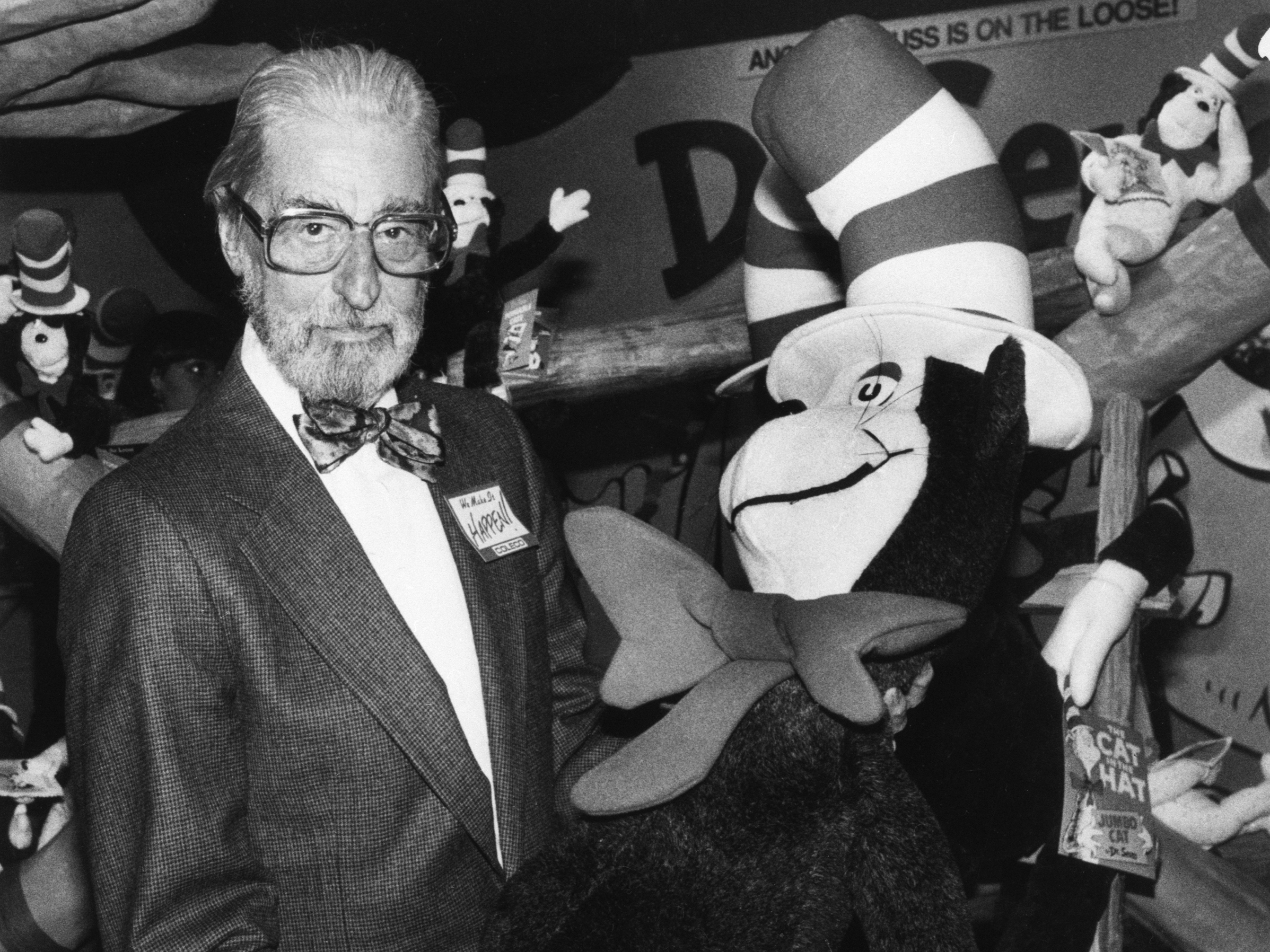 Theodor Geisel — Dr. Seuss --holds a toy of the Cat in the Hat, one of his most famous character creations. (Bettmann Archive)
