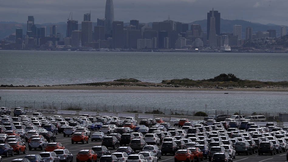 New cars sit in a lot at the Auto Warehousing Co. near the Port of Richmond in Caliornia last year. President Trump has threatened to impose heavy tariffs on auto imports, but the White House has not announced a decision. (Justin Sullivan/Getty Images)