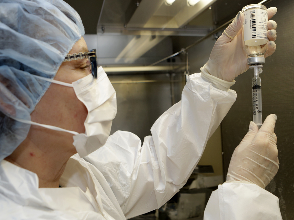 Pharmacy technician Peggy Gillespie fills a syringe with an antibiotic at ProMedica Toledo Hospital in Toledo, Ohio, in January.