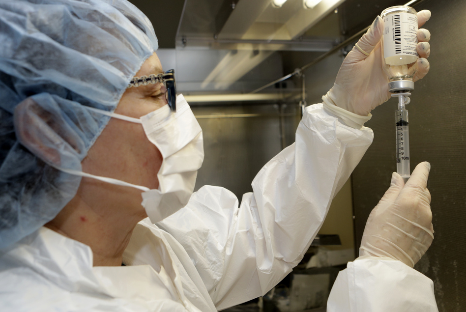 Pharmacy technician Peggy Gillespie fills a syringe with an antibiotic at ProMedica Toledo Hospital in Toledo, Ohio, in January. (Tony Dejak/AP)
