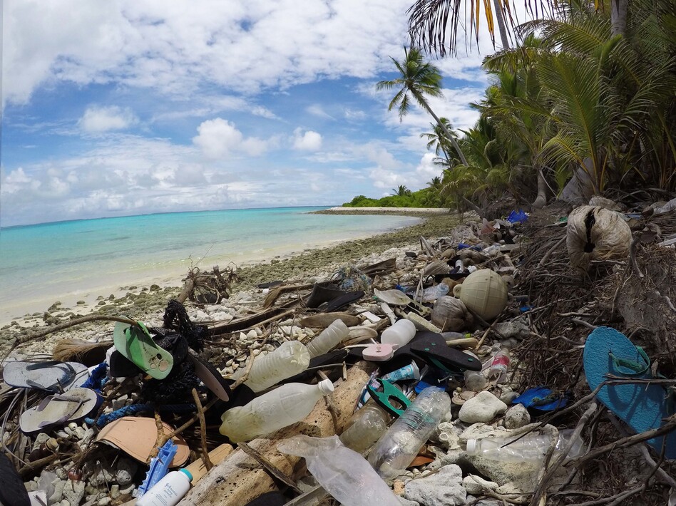 Debris blankets the north side of one of the Cocos Keeling Islands in the Indian Ocean. Researchers found a huge amount of plastic both onshore and buried in the sand.