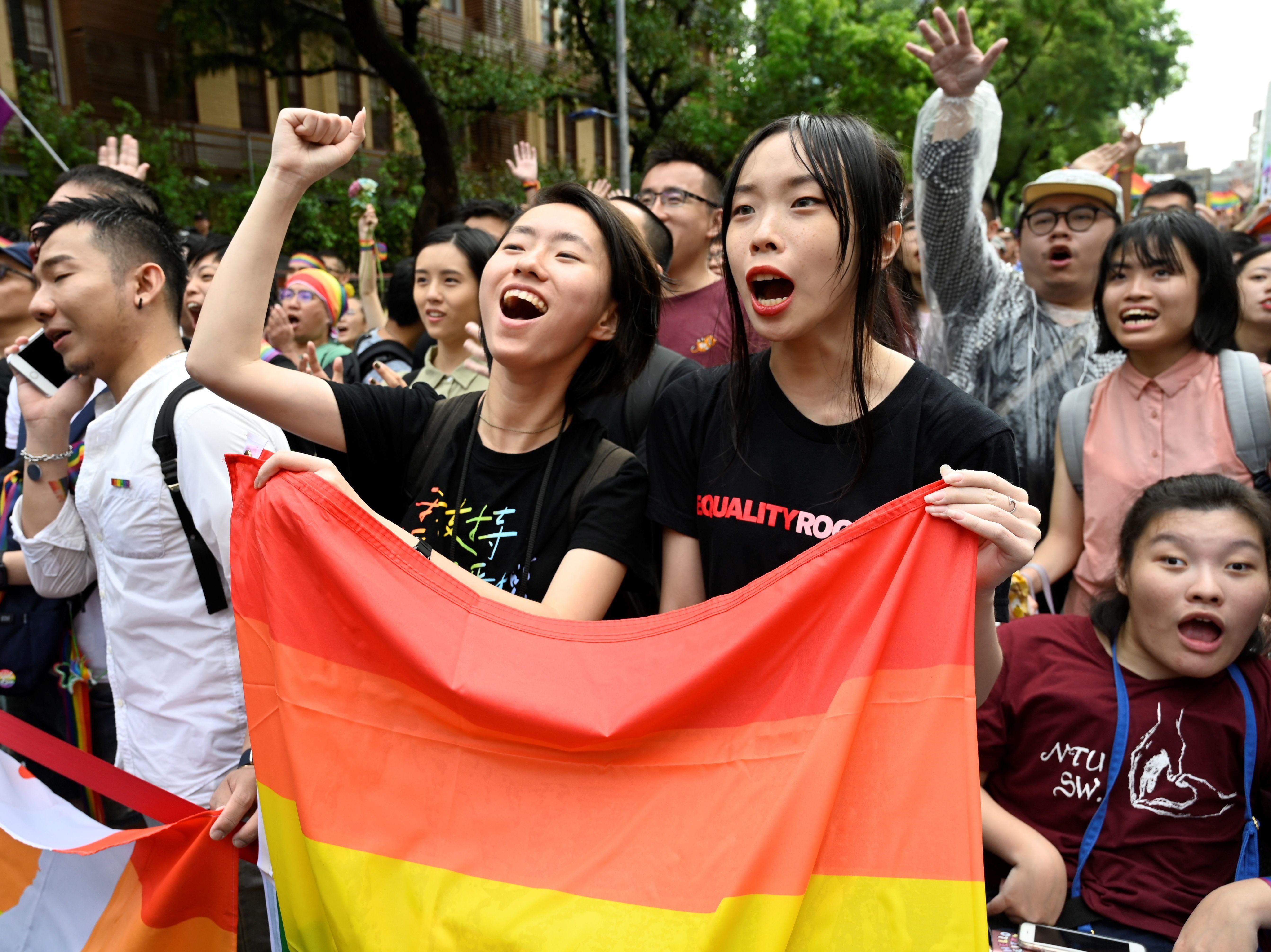 In a landmark first for Asia, Taiwan has legalized same-sex marriage. Supporters celebrate the bill's passage outside parliament in Taipei on Friday.