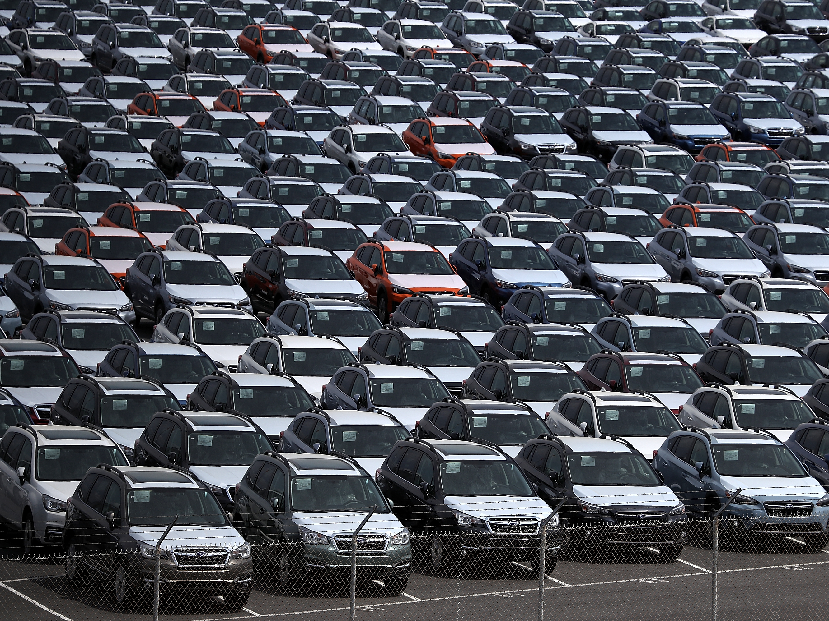 New cars sit in a lot at the Port of Richmond in California last year. The Trump administration on Friday announced a six-month delay in setting new tariffs on auto imports. (Getty Images)