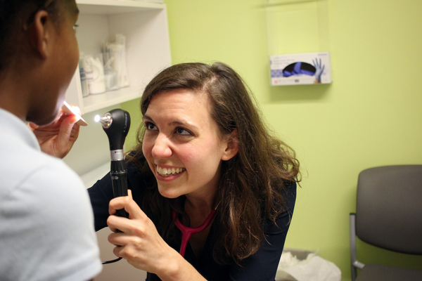 Public health experts suggest every doctor visit is an opportunity to vaccinate. Dr. Melanie Siefman examines an 11-year-old patient at a Unity Health Care clinic in Washington D.C. who came in for allergies, and ended up getting three vaccinations.