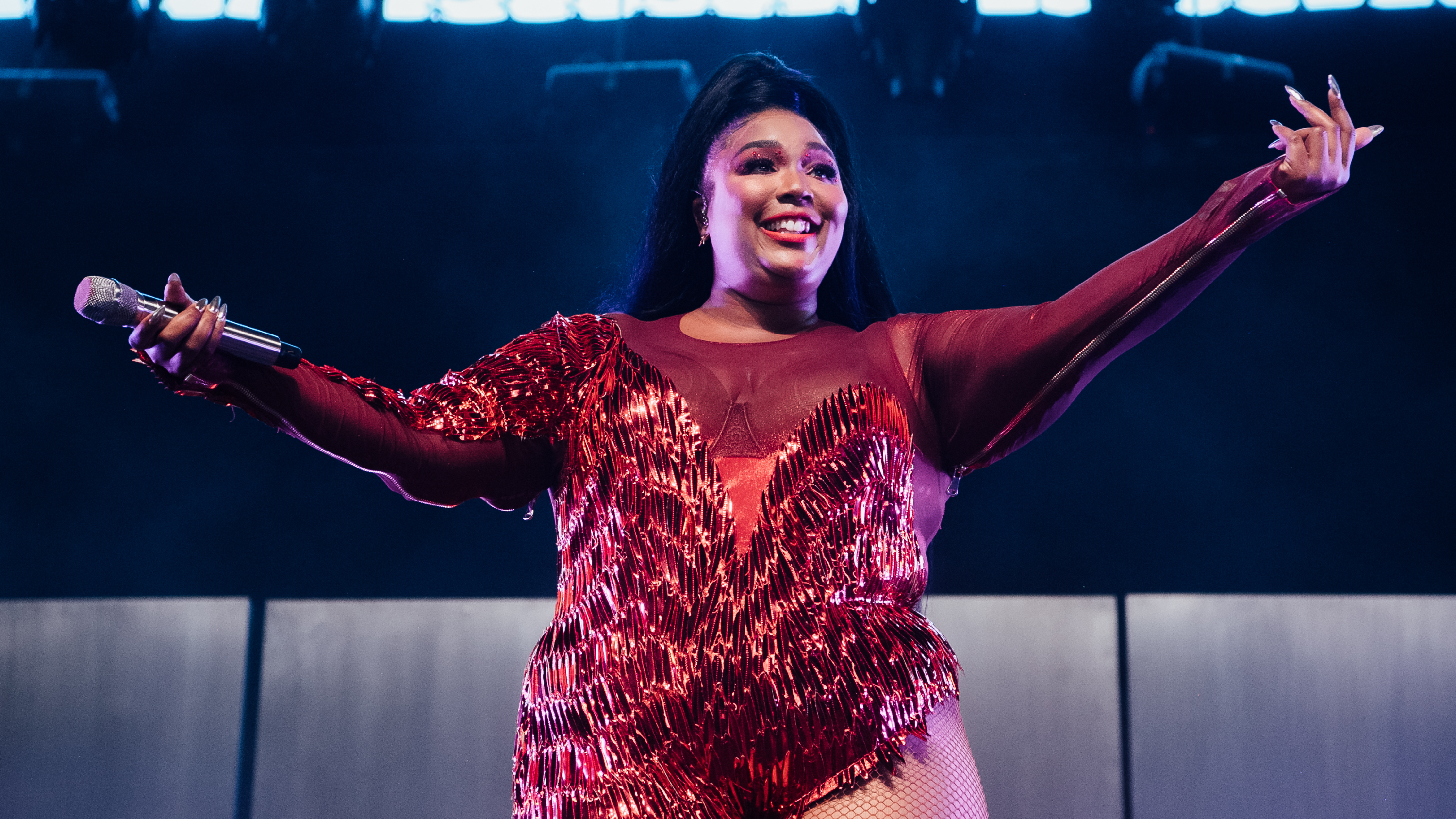 Lizzo performs onstage at Coachella on April 21 in Indio, Calif. The flute-playing singer and rapper celebrates self-acceptance on her latest album, <em>Cuz I Love You.</em> (Getty Images for Coachella)