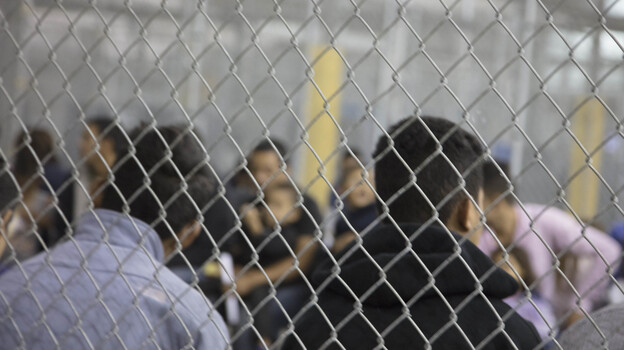 U.S. Border Patrol agents conduct intake at the Central Processing Center in McAllen, Texas. The center is temporarily not taking in migrants after the outbreak of "a flu-related illness." (U.S. Customs And Border Protection/Getty Images)