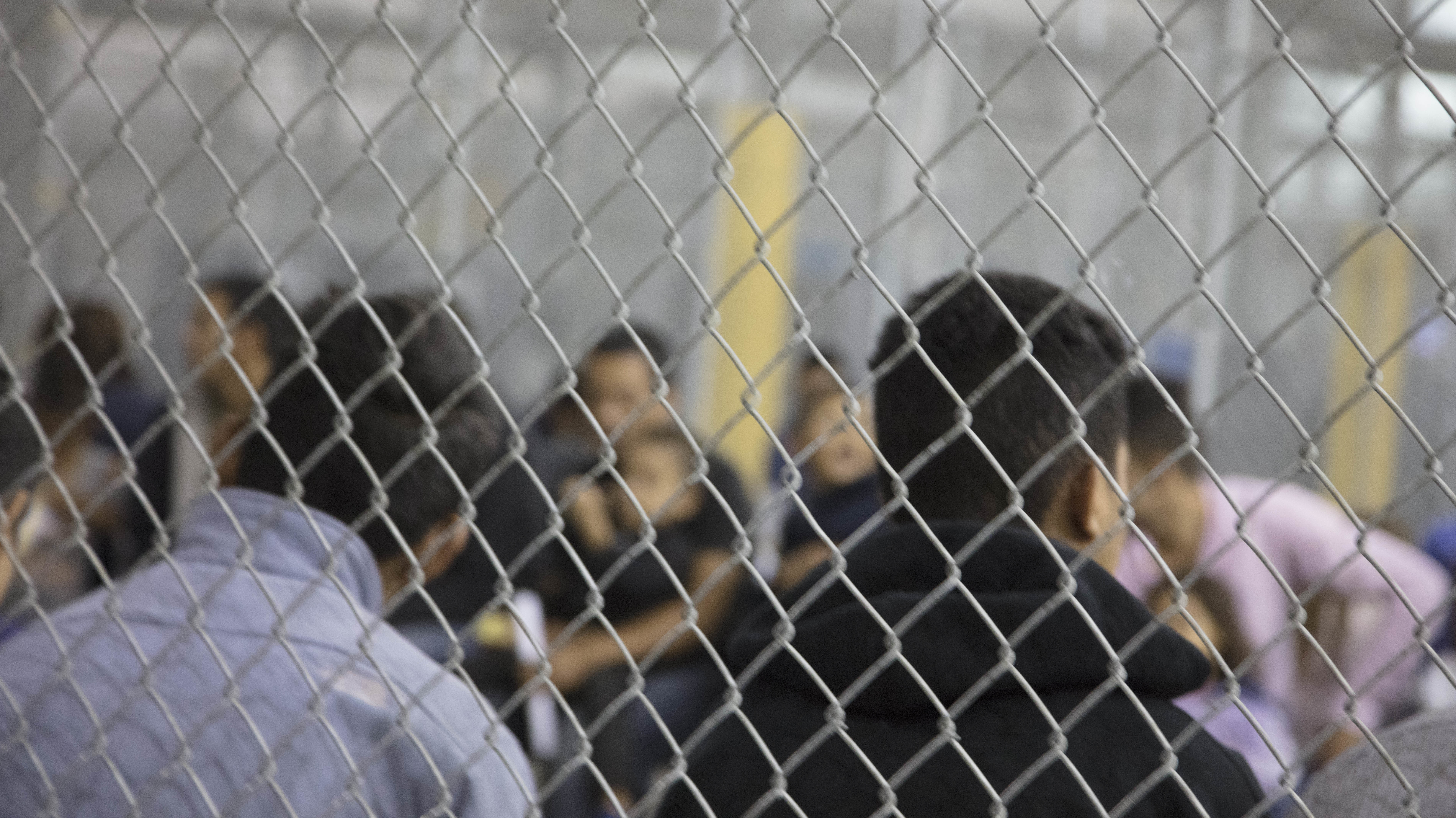 U.S. Border Patrol agents conduct intake at the Central Processing Center in McAllen, Texas. The center is temporarily not taking in migrants after the outbreak of &quot;a flu-related illness.&quot; (U.S. Customs And Border Protection/Getty Images)