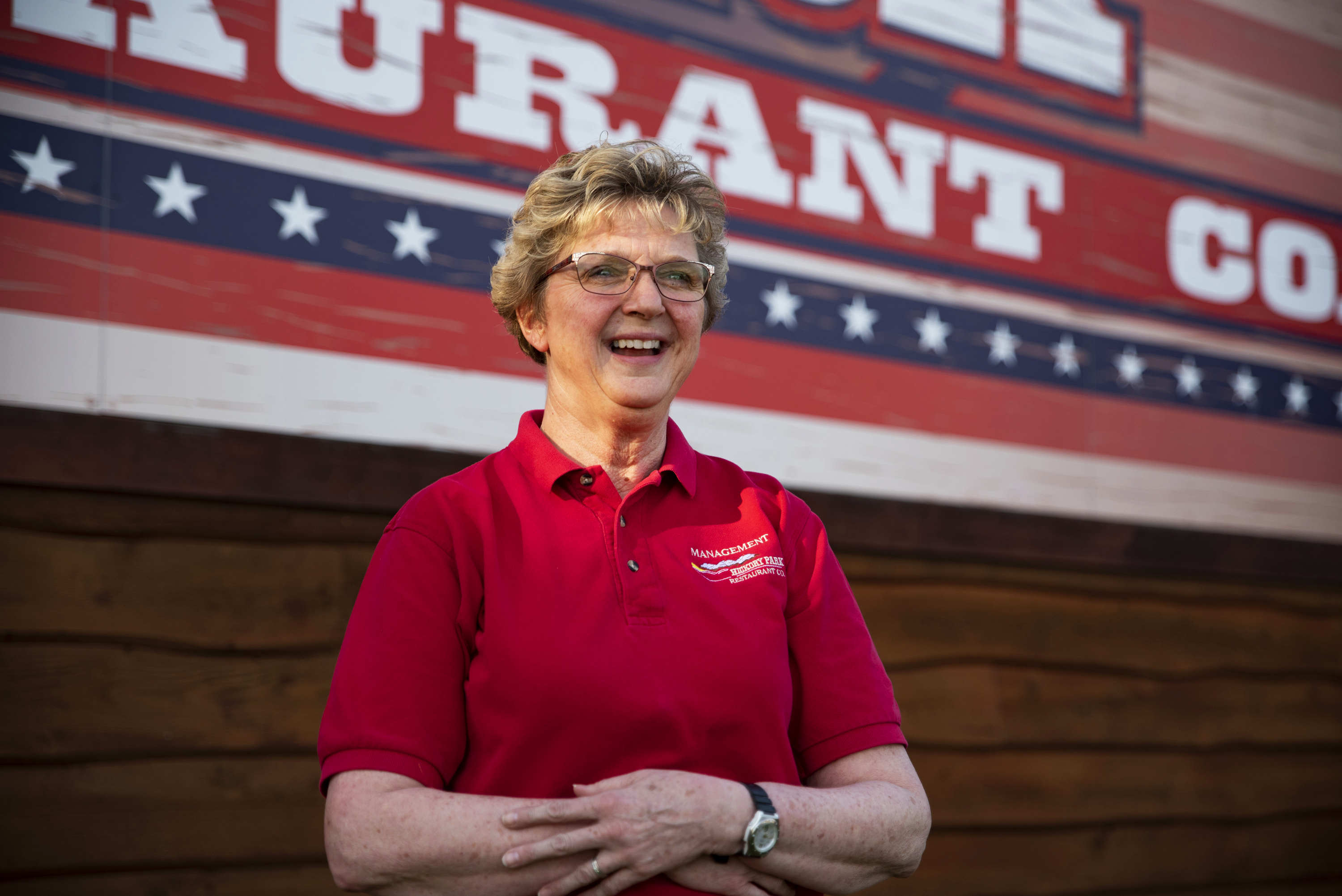 Elizabeth Kopecky, a manager at Hickory Park, stands outside the restaurant. She says hiring is tricky, often with little time to check references.