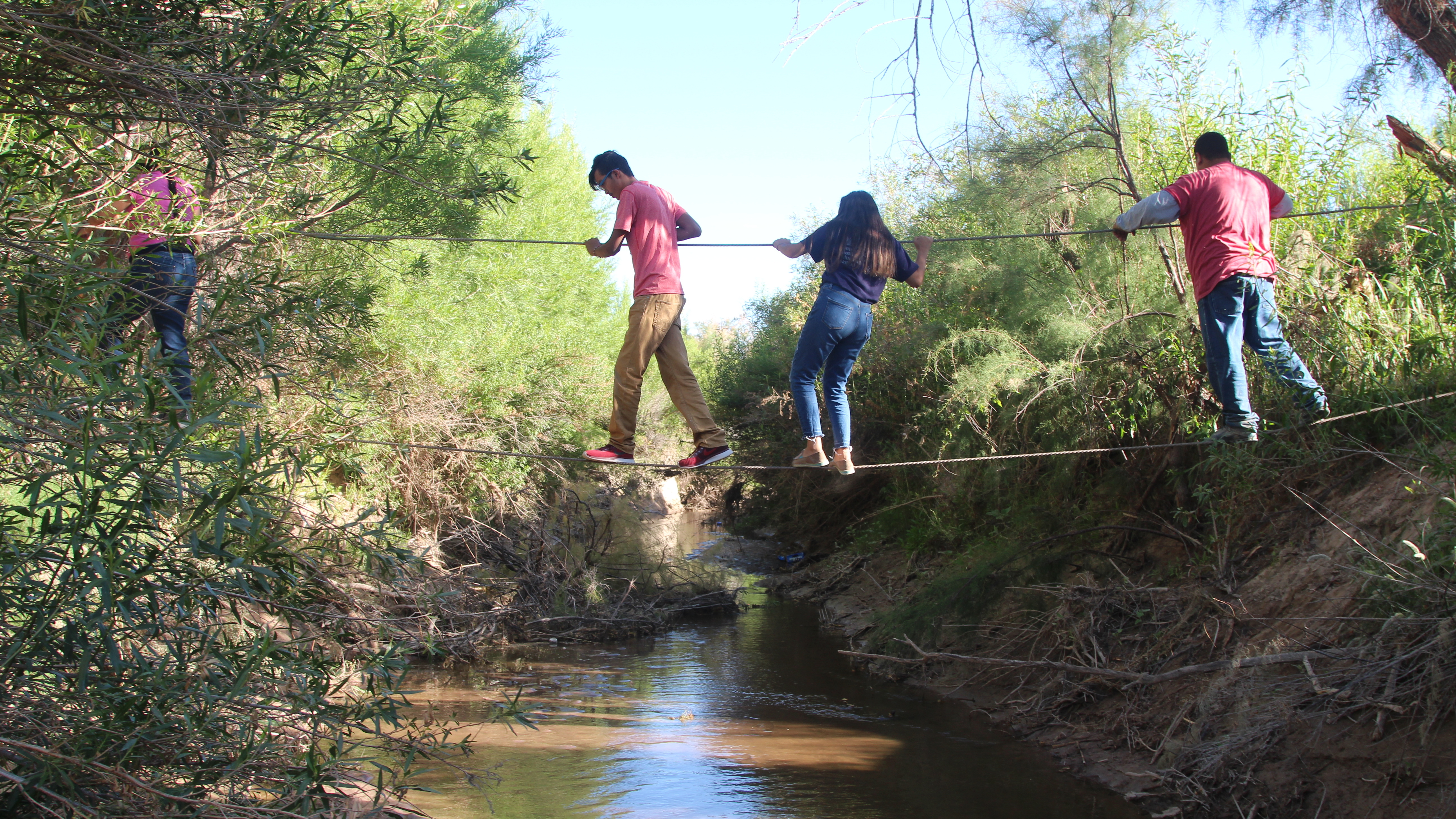 U.S. citizens use ropes to cross the Rio Grande from San Antonio del Bravo, Mexico, into Candelaria, Texas. U.S. citizens depend on the free health clinic in San Antonio del Bravo. (Lorne Matalon for NPR)