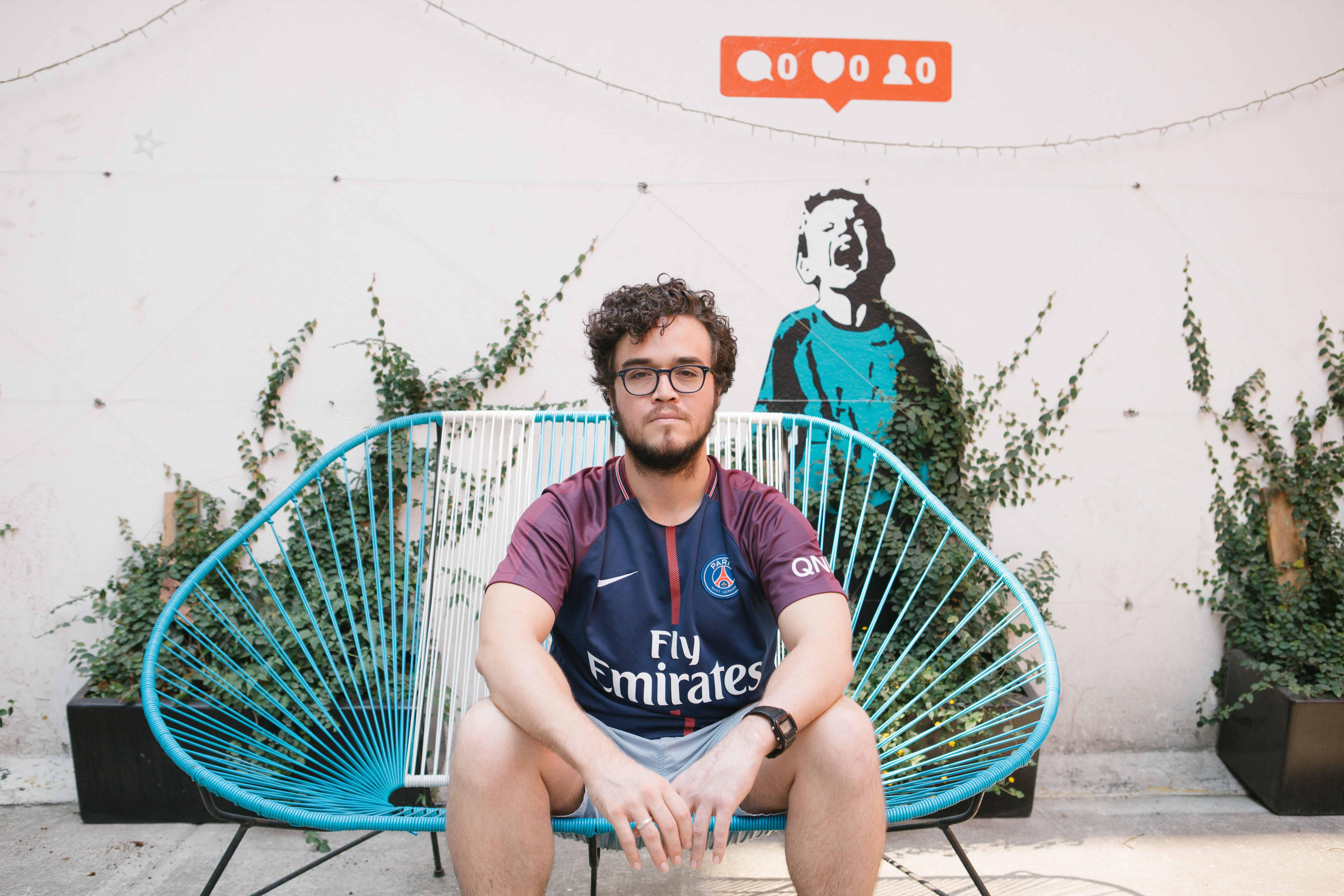 Claudio Gage poses for a portrait at the Hola Code offices in Mexico City on May 13. Gage was deported to Mexico after having lived in the U.S. for more than a decade. (Alicia Vera for NPR)