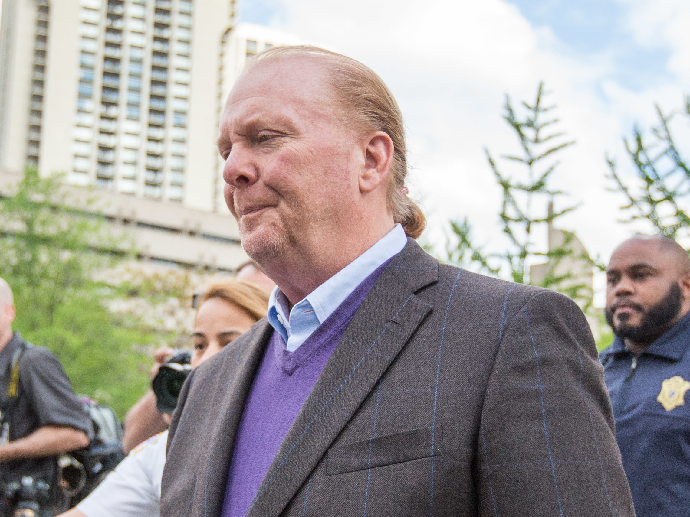 Celebrity chef Mario Batali leaves Boston Municipal Court on Friday following a court appearance on a charge of indecent assault and battery in connection with a 2017 incident at a restaurant of his in Boston. (Getty Images)