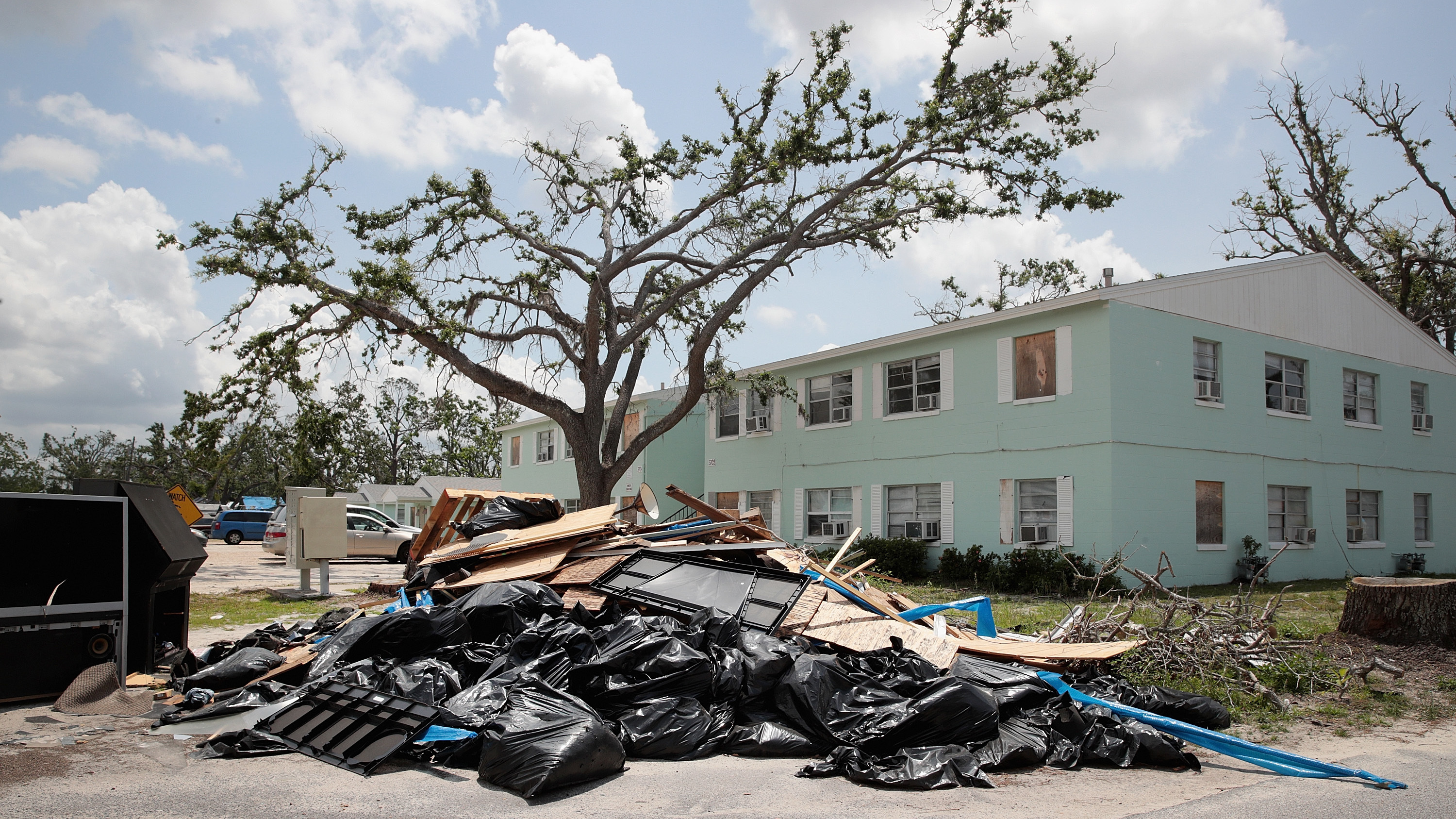 Debris is piled on May 10 outside an apartment complex that was damaged by Hurricane Michael in Panama City, Fla. Rep. Chip Roy objected to a procedural vote on a bipartisan $19.1 billion disaster aid bill, forcing Congress to wait until June to finish work on the legislation. (Getty Images)