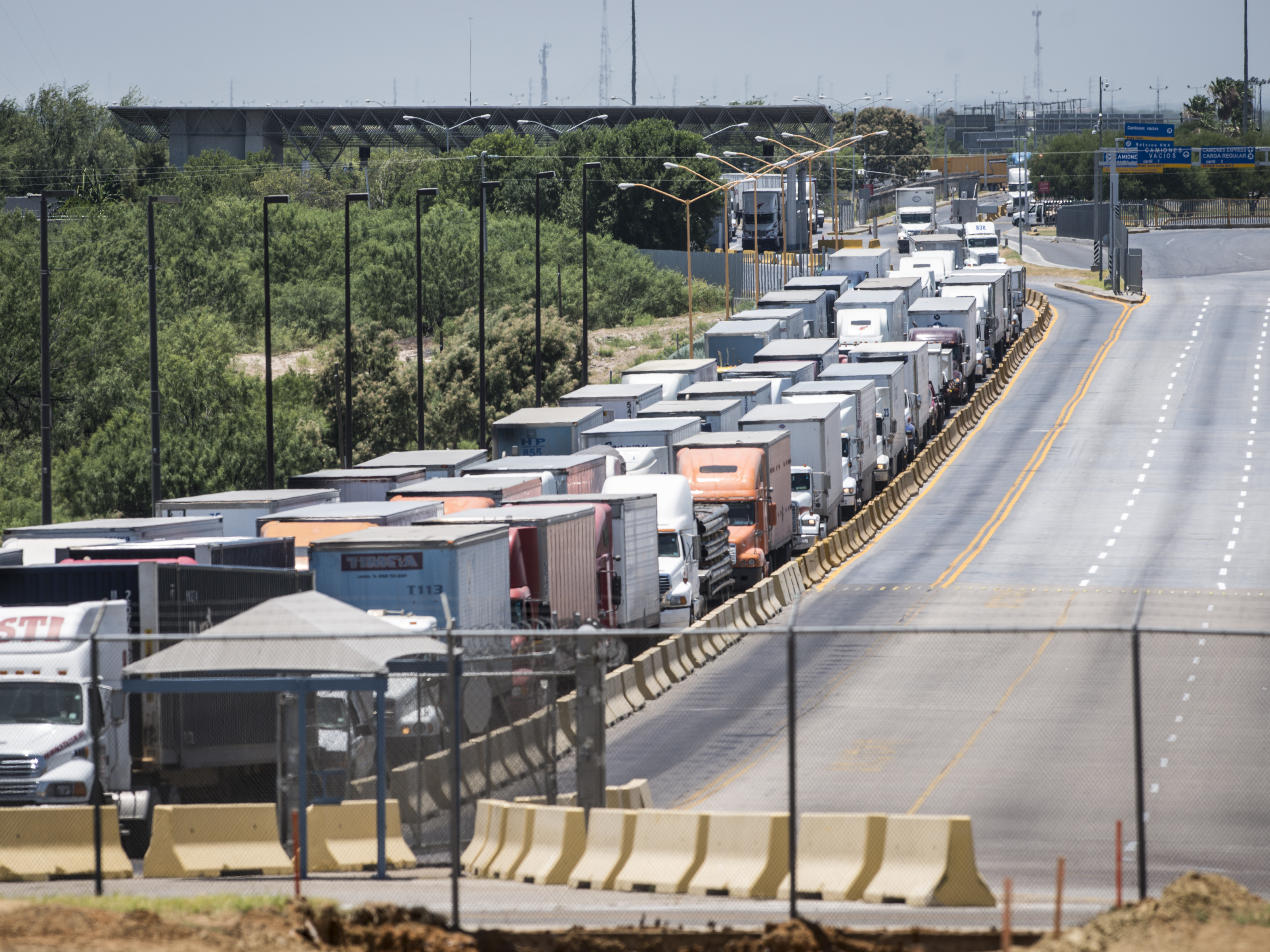 Traffic backs up along the route to the border crossing from Mexico to the U.S. in Laredo, Texas in 2015. Mexico recently surpassed China and Canada as America's top trading partner, which helped catapult Laredo past Los Angeles to become the number one port in the country. (Getty Images)