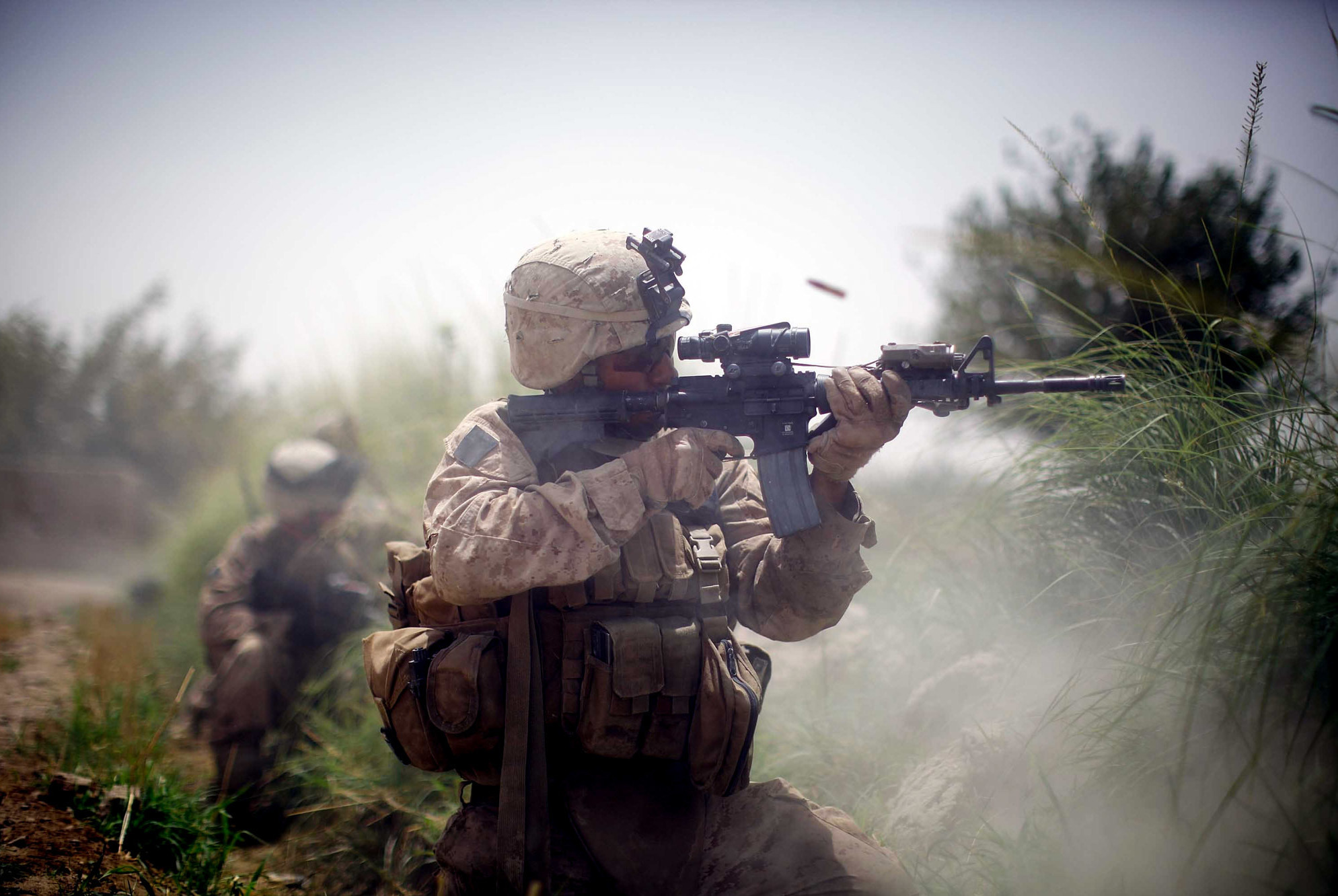 An Artist And A Warrior: Colleague Remembers Fallen NPR Photographer David Gilkey 2 A U.S. Marine from the 2nd Marine Expeditionary Brigade, RCT 2nd Battalion, 8th Marines, Golf Company engages in a firefight on July 8, 2009, in Mian Poshteh, Afghanistan.