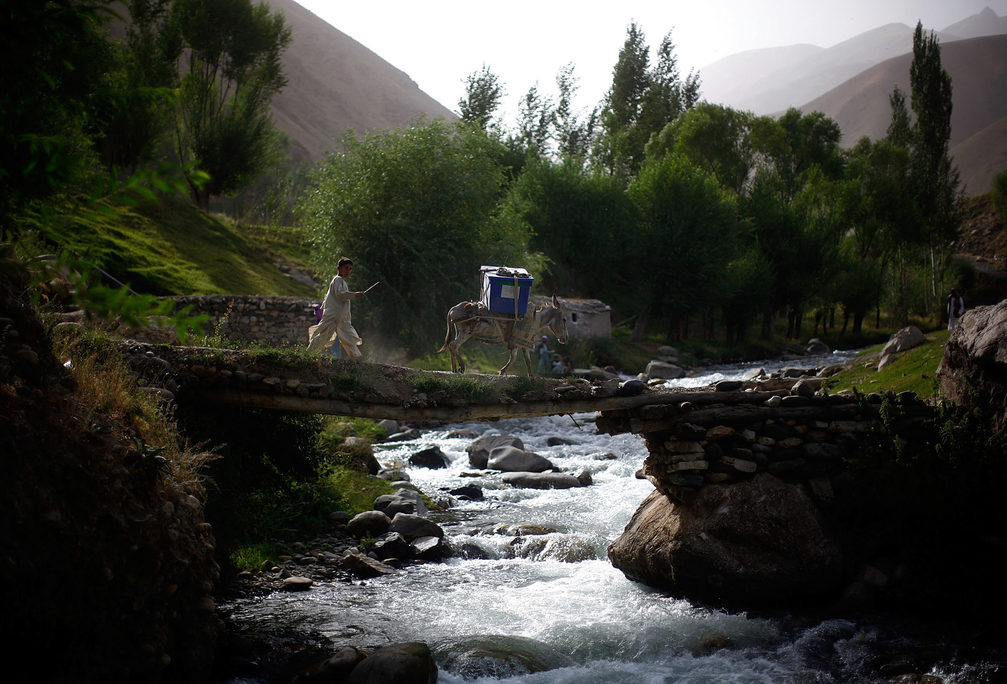 An Artist And A Warrior: Colleague Remembers Fallen NPR Photographer David Gilkey 19 A boy and his donkey cross a stream while on their way to the village of Quali Kuana in Afghanistan's Badakhshan province.