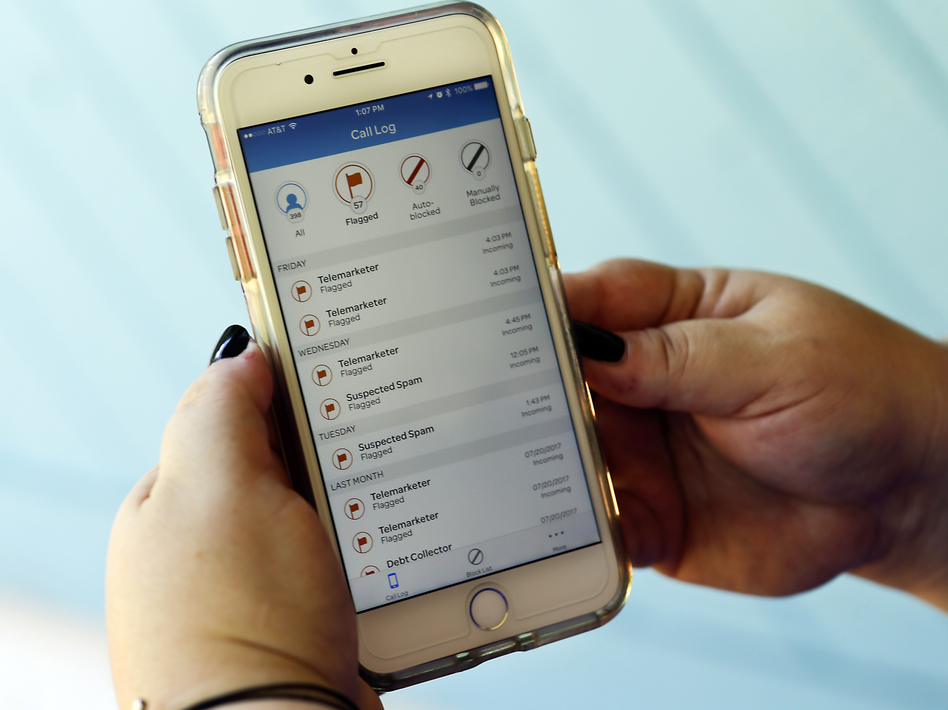 The Federal Communications Commission is pushing phone companies to implement robocall blocking services by default. (John Raoux/AP)