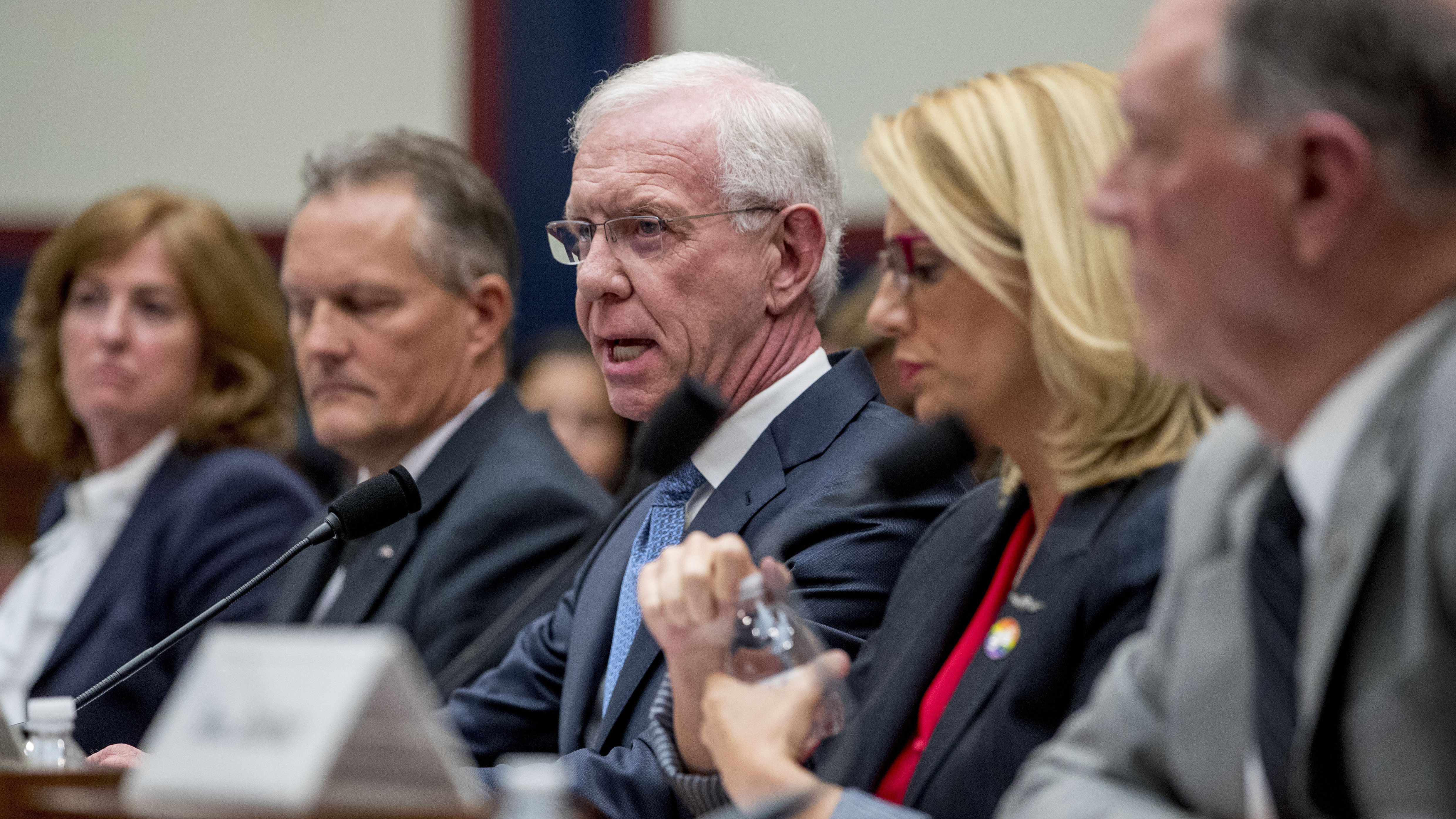 Capt. Chesley "Sully" Sullenberger, accompanied by other pilots and former FAA administrator Randy Babbitt, speaks during a House Committee on Transportation and Infrastructure hearing on the status of the Boeing 737 Max in Washington, D.C.