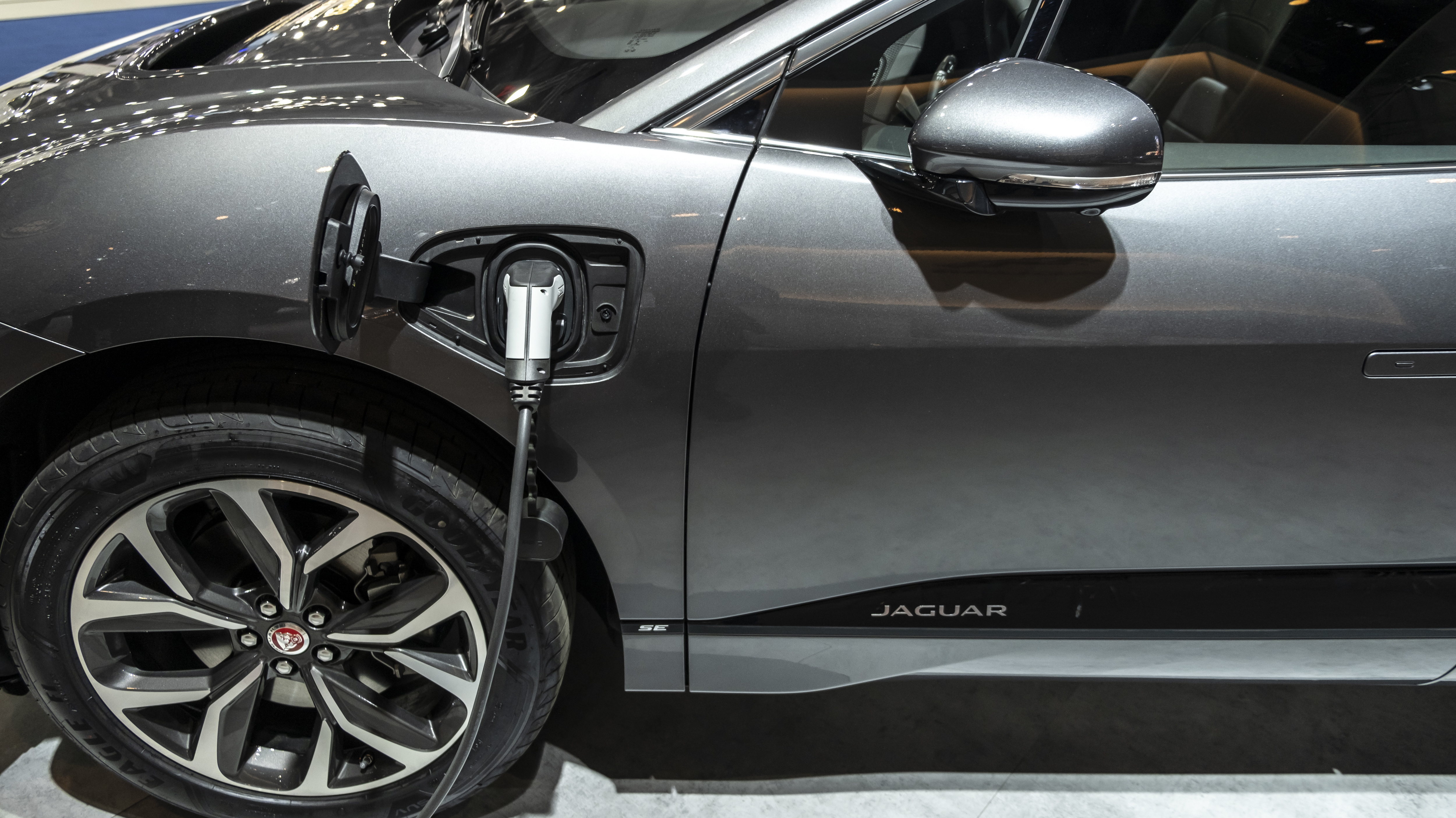 A Jaguar I-Pace, the first electric vehicle from the premium carmaker, charges during an event in Barcelona, Spain, in May. (LightRocket via Getty Images)